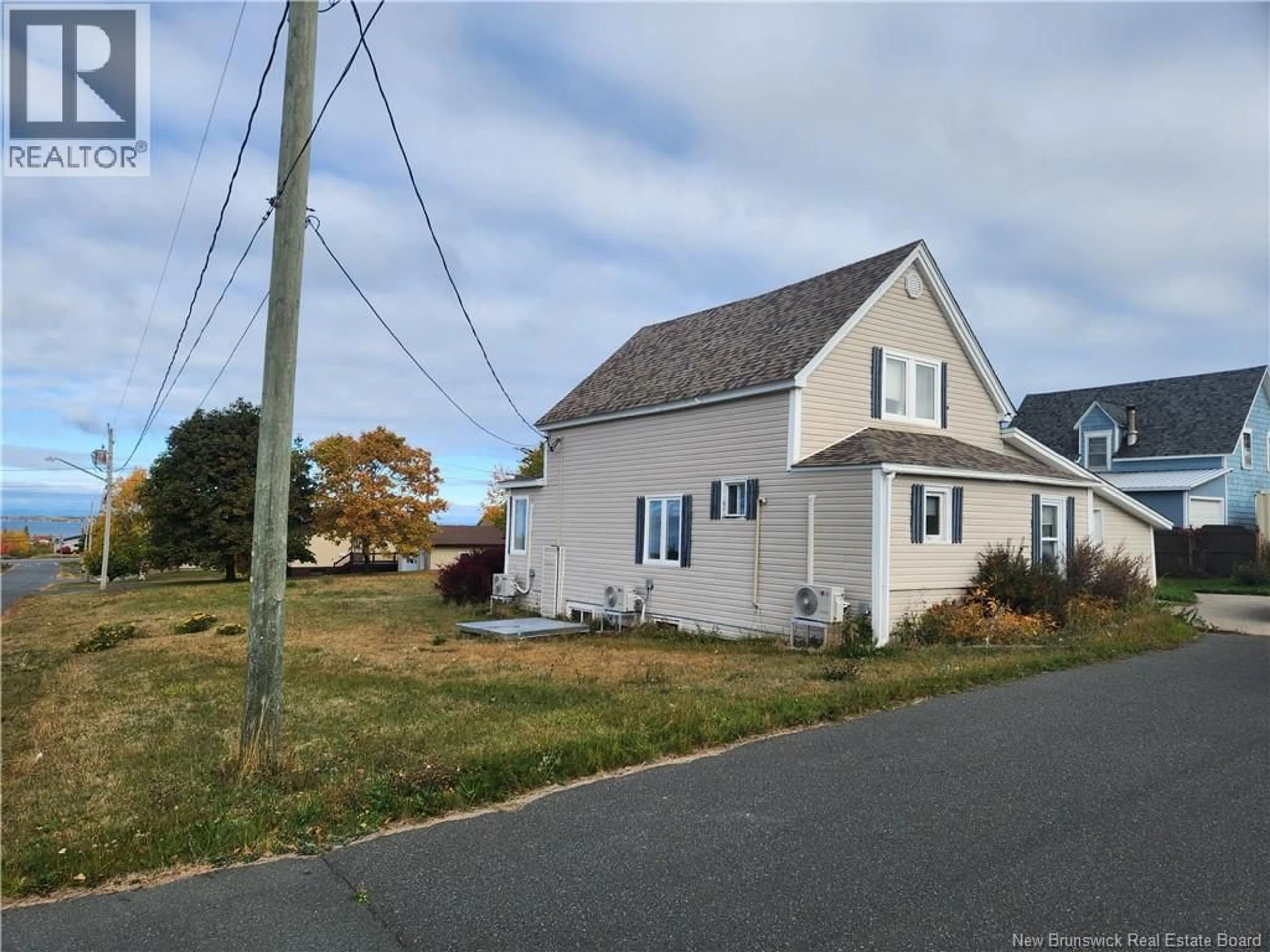 Home with vinyl exterior material, street for 10 GIONET, Caraquet New Brunswick E1W1A3