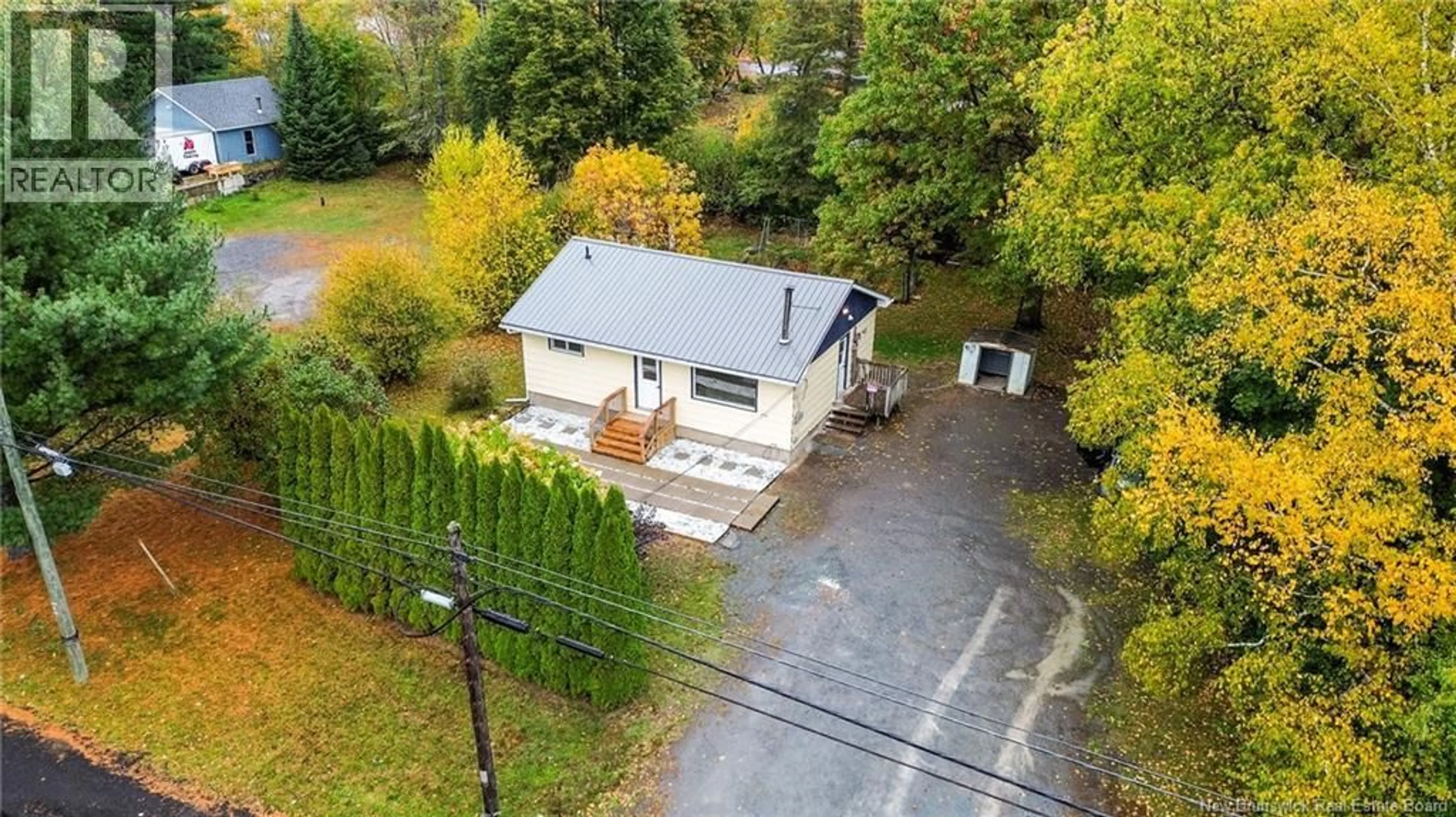A pic from outside/outdoor area/front of a property/back of a property/a pic from drone, street for 865 RIVERSIDE DRIVE, Fredericton New Brunswick E3A8R1