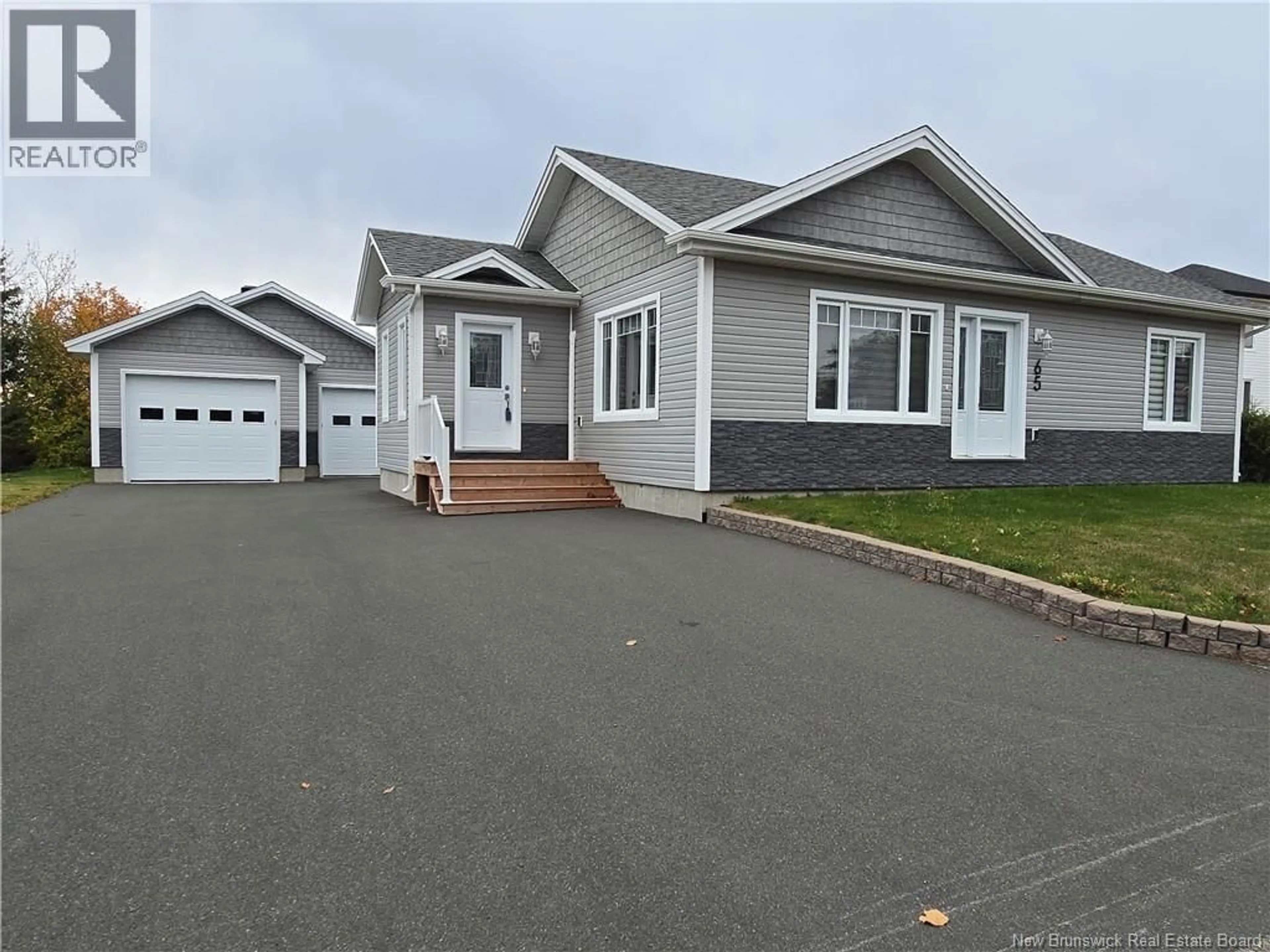 Home with vinyl exterior material, street for 65 GRANT STREET, Petit-Rocher New Brunswick E8J1G5