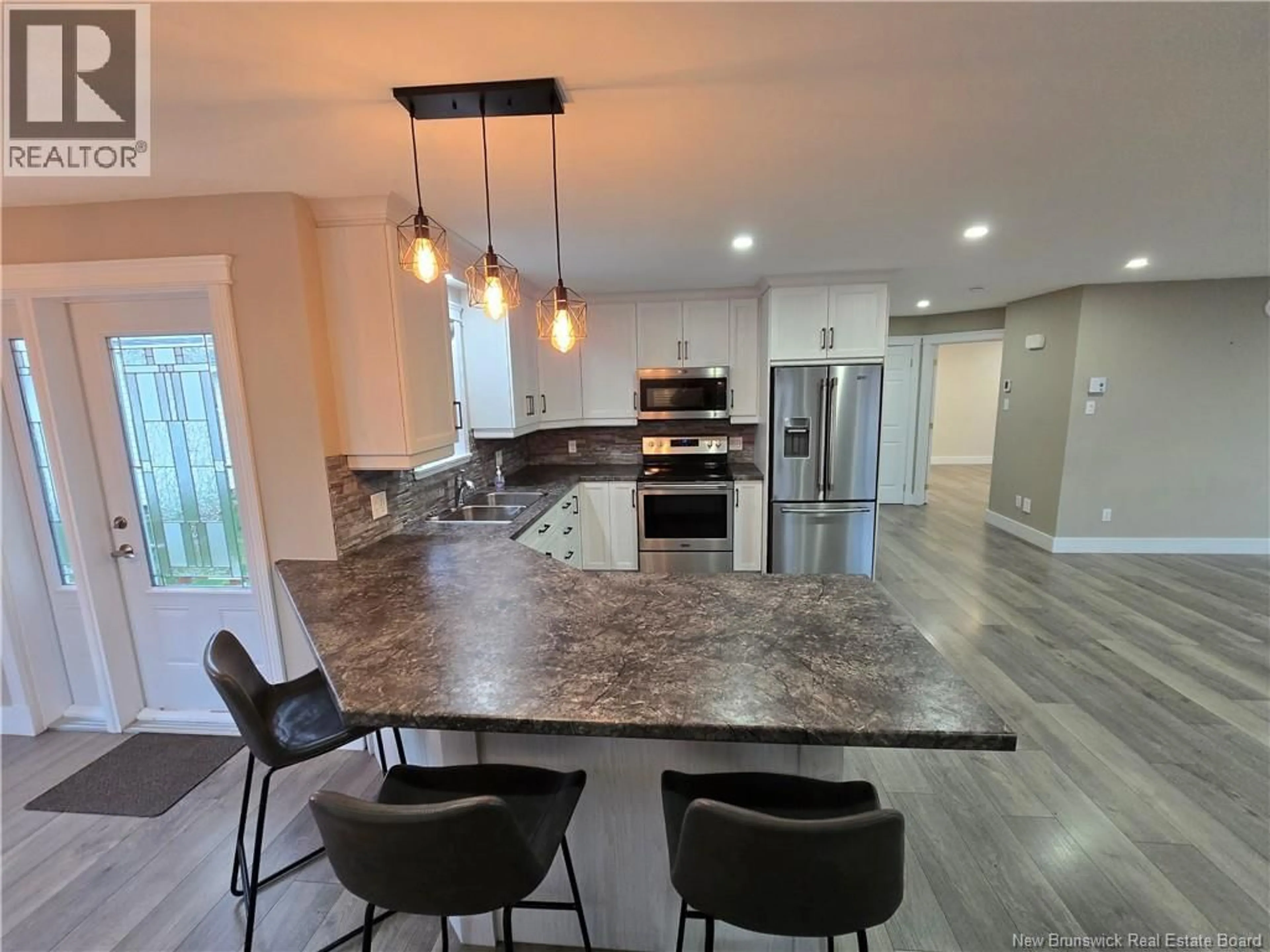 Open concept kitchen, ceramic/tile floor for 65 GRANT STREET, Petit-Rocher New Brunswick E8J1G5