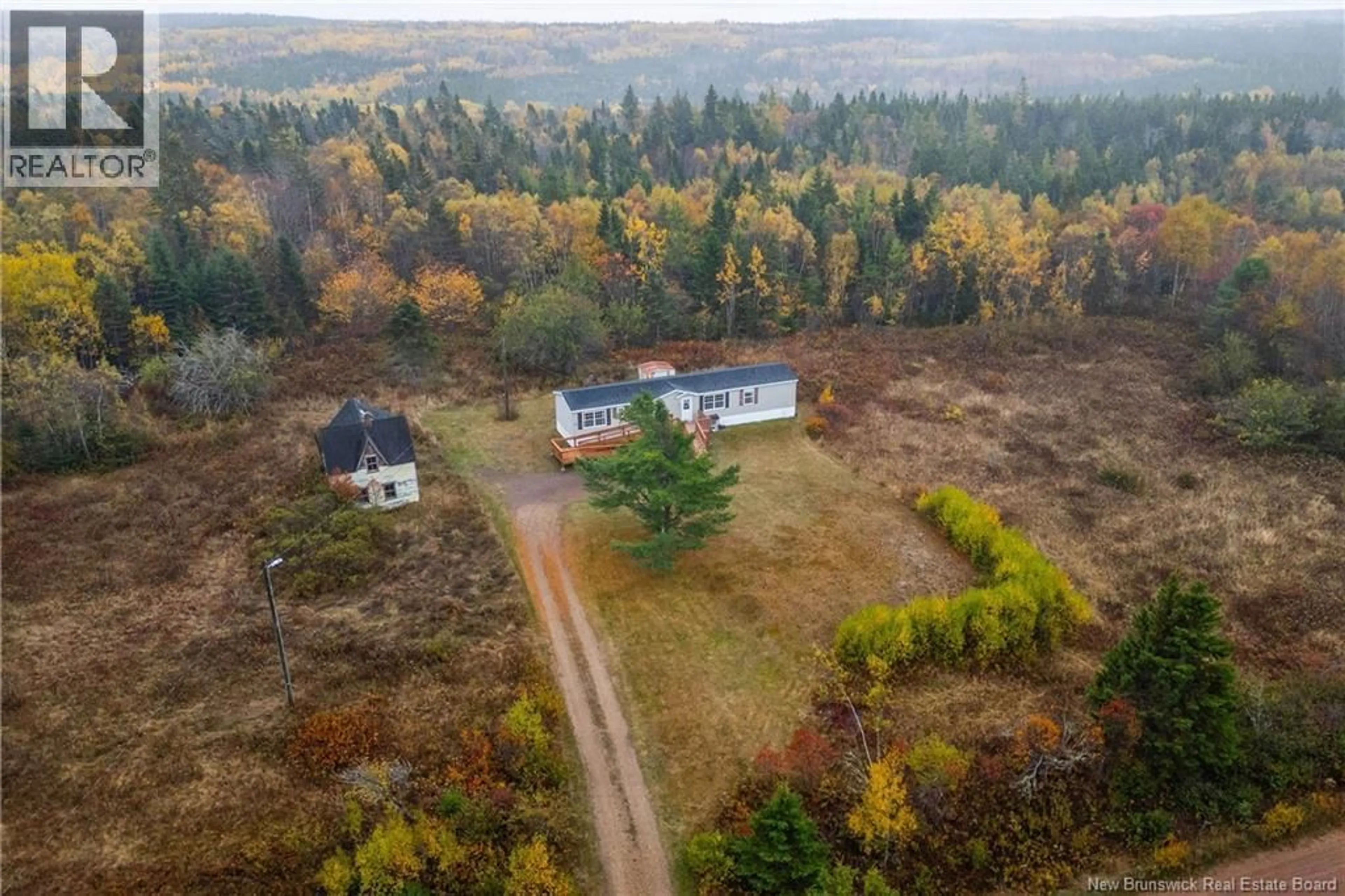 A pic from outside/outdoor area/front of a property/back of a property/a pic from drone, forest/trees view for 292 BRITISH SETTLEMENT ROAD, British Settlement New Brunswick E4L2G2