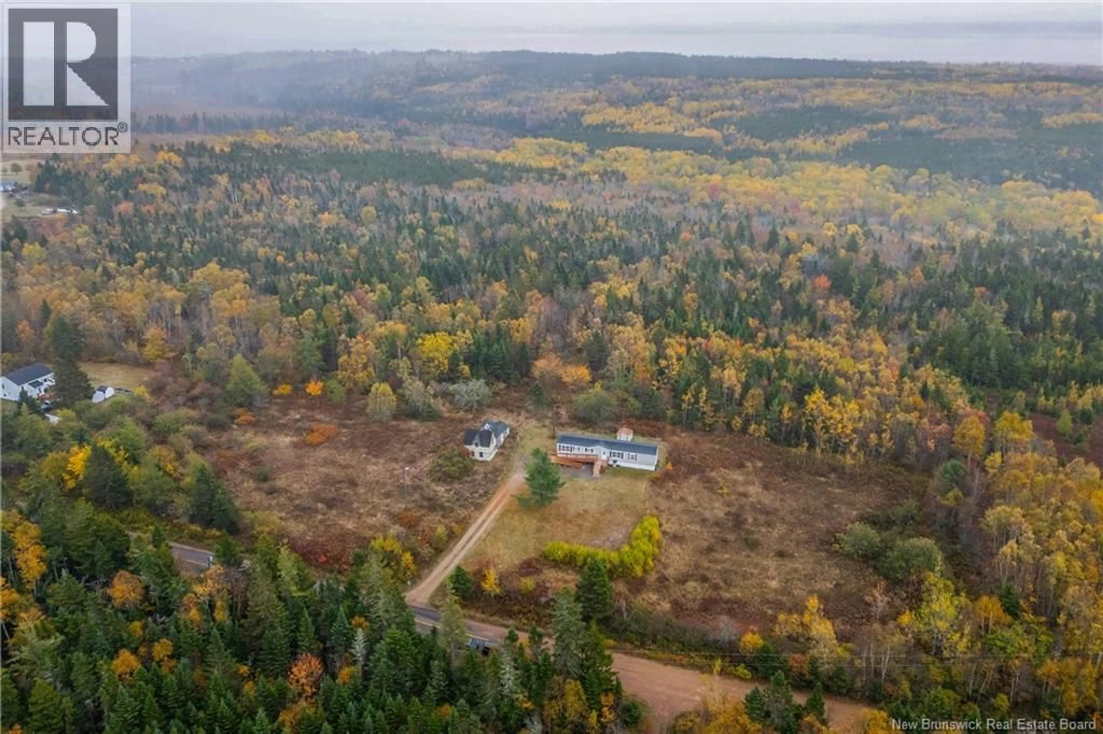 A pic from outside/outdoor area/front of a property/back of a property/a pic from drone, forest/trees view for 292 BRITISH SETTLEMENT ROAD, British Settlement New Brunswick E4L2G2