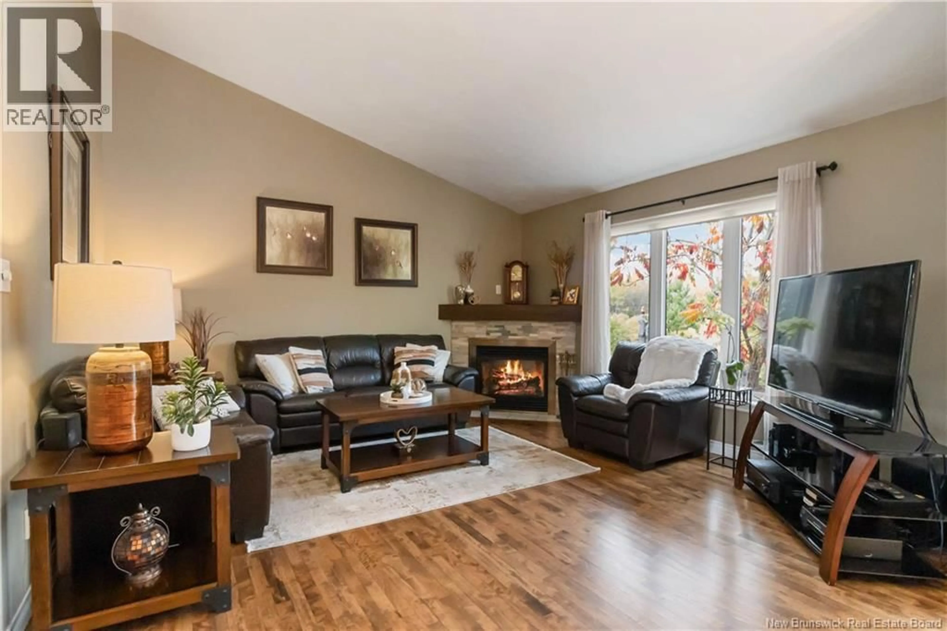 Living room with furniture, wood/laminate floor for 1314 ELMWOOD DRIVE, Moncton New Brunswick E1H2H3