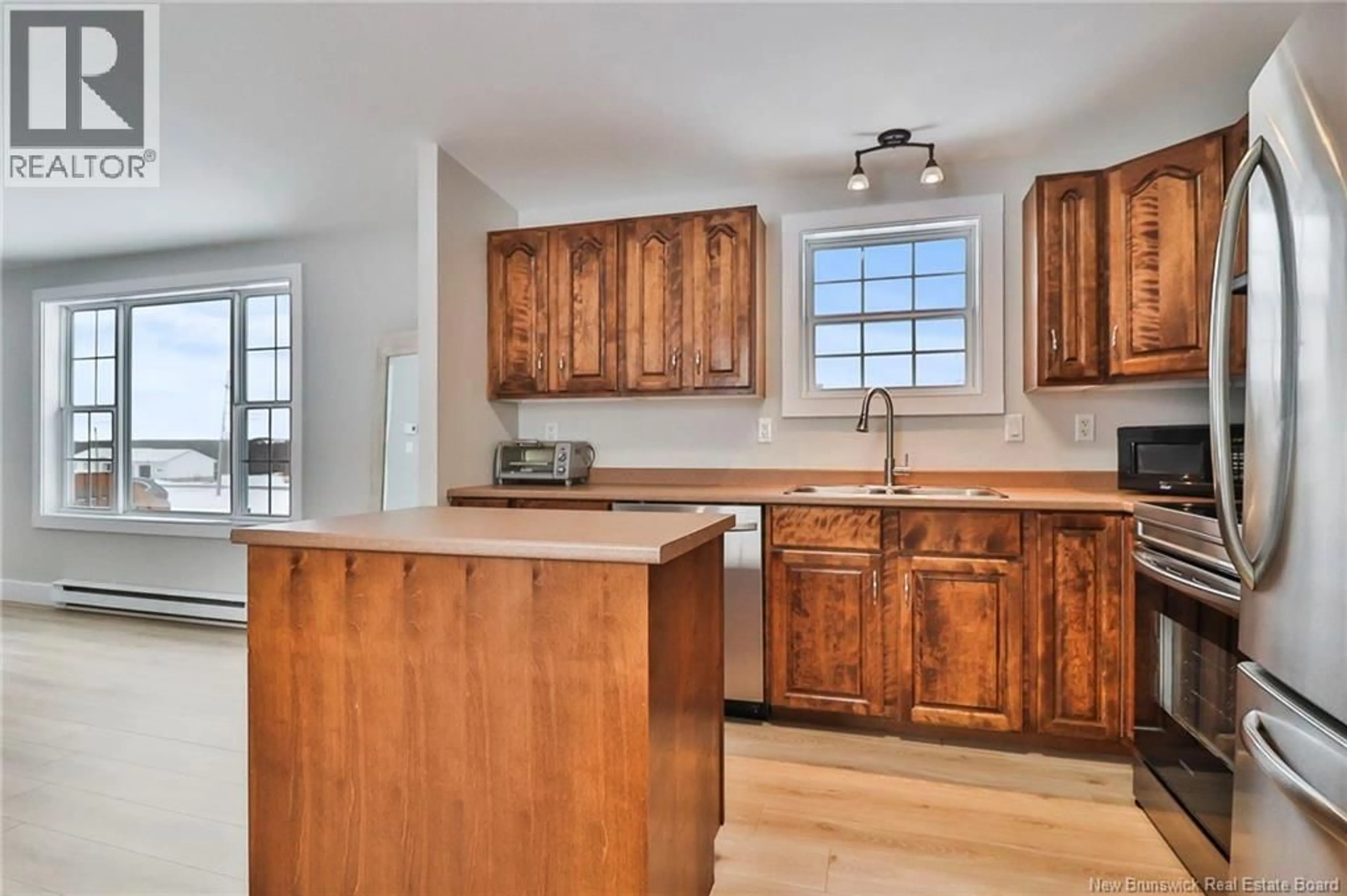 Open concept kitchen, wood/laminate floor for 475 ABOUJAGANE ROAD, Haute-Aboujagane New Brunswick E4P5M2