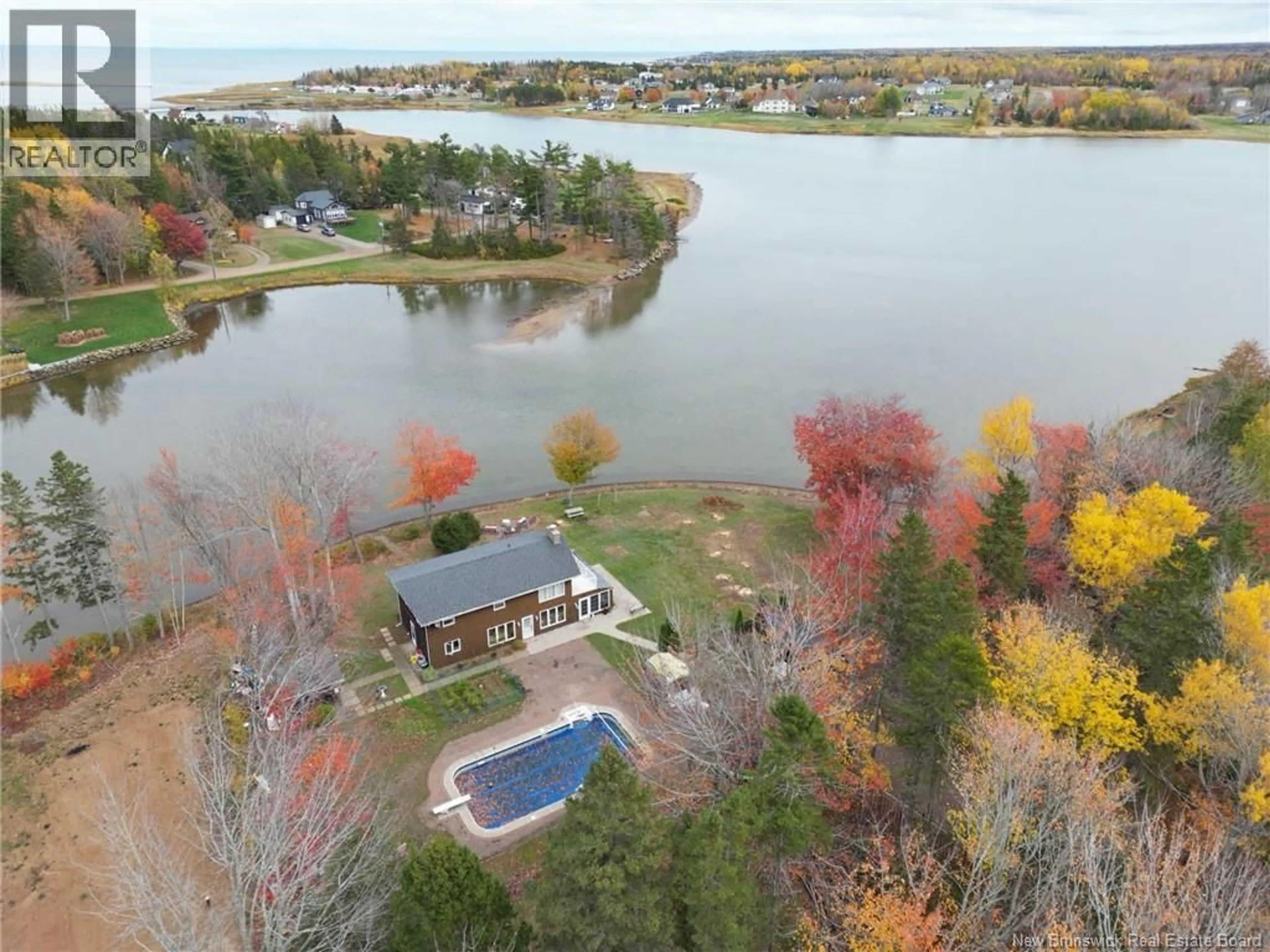 A pic from outside/outdoor area/front of a property/back of a property/a pic from drone, water/lake/river/ocean view for 74 SOLEIL, Grand-Barachois New Brunswick E4P8M3