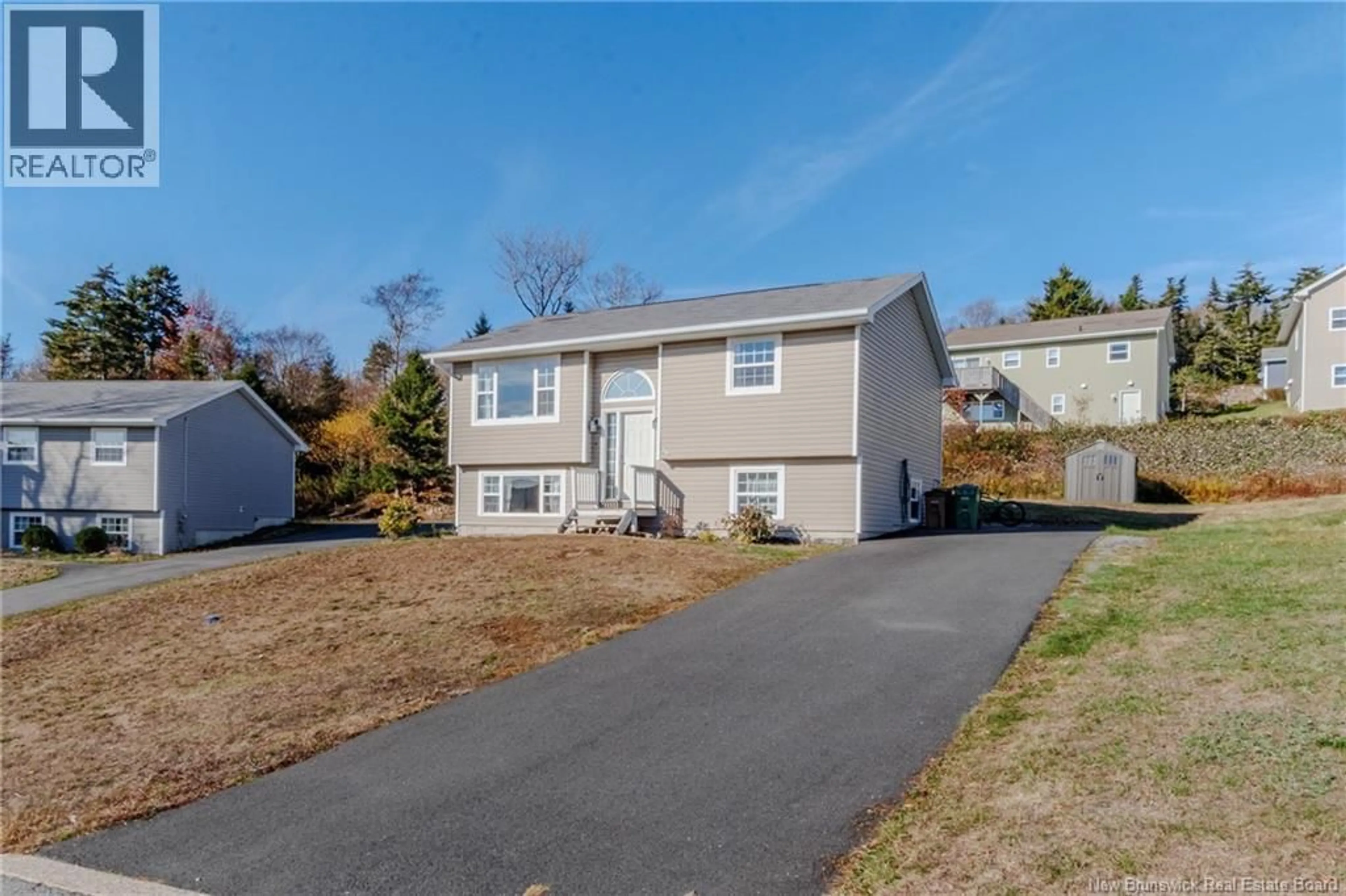 Home with vinyl exterior material, street for 15 DOLLY DRIVE, Saint John New Brunswick E2J0C9