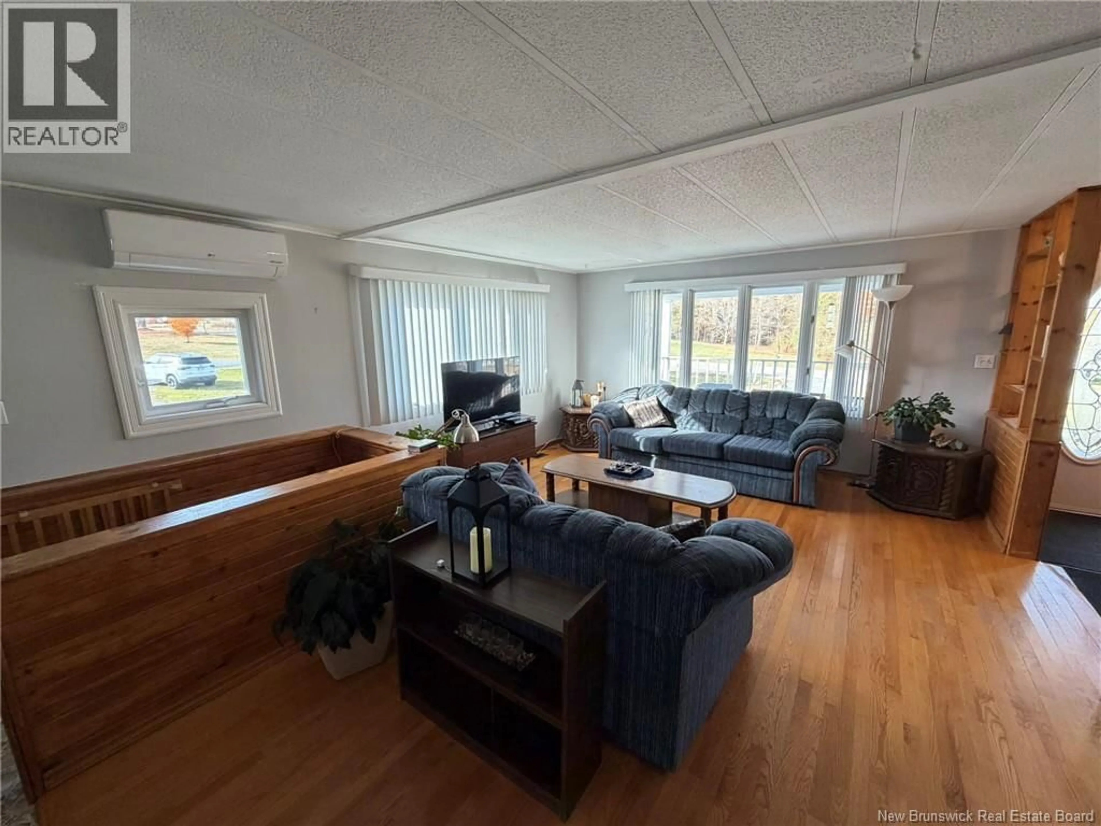 Living room with furniture, wood/laminate floor for 891 555 ROUTE, Richmond Corner New Brunswick E7M4X2