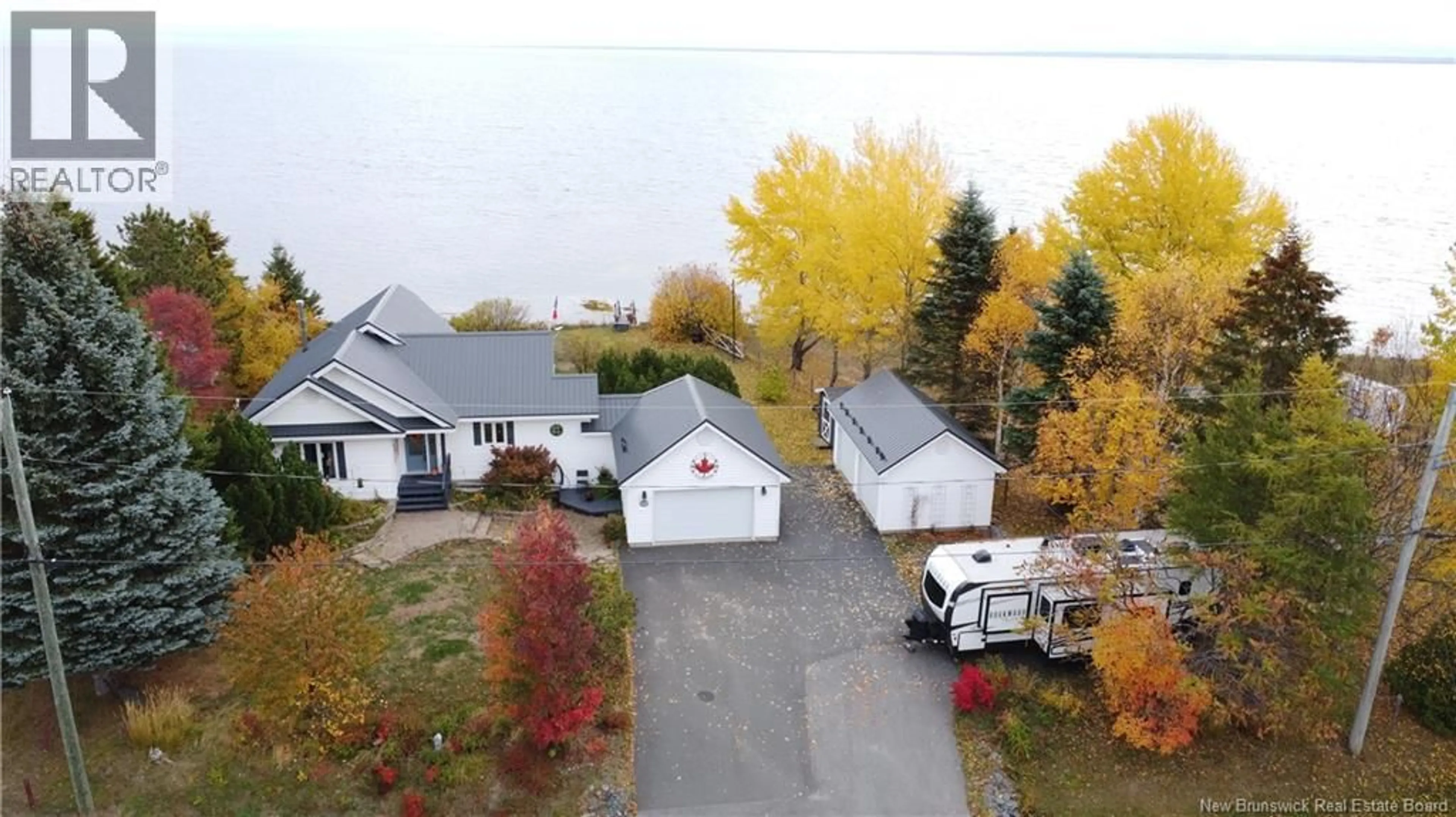 A pic from outside/outdoor area/front of a property/back of a property/a pic from drone, street for 425 DE LA BAIE, Nigadoo New Brunswick E8K3P8