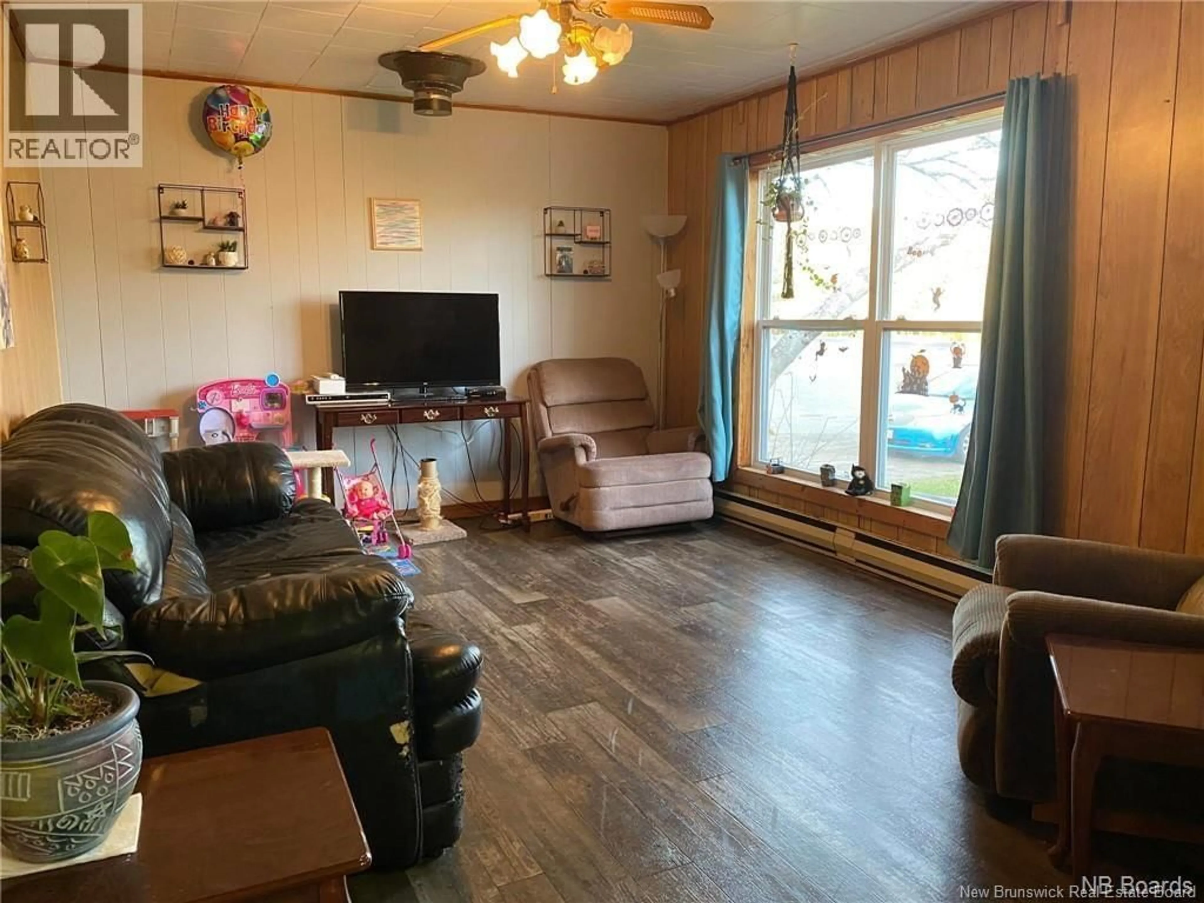 Living room with furniture, wood/laminate floor for 12799 RTE 8 HWY, Blackville New Brunswick E9B1T7