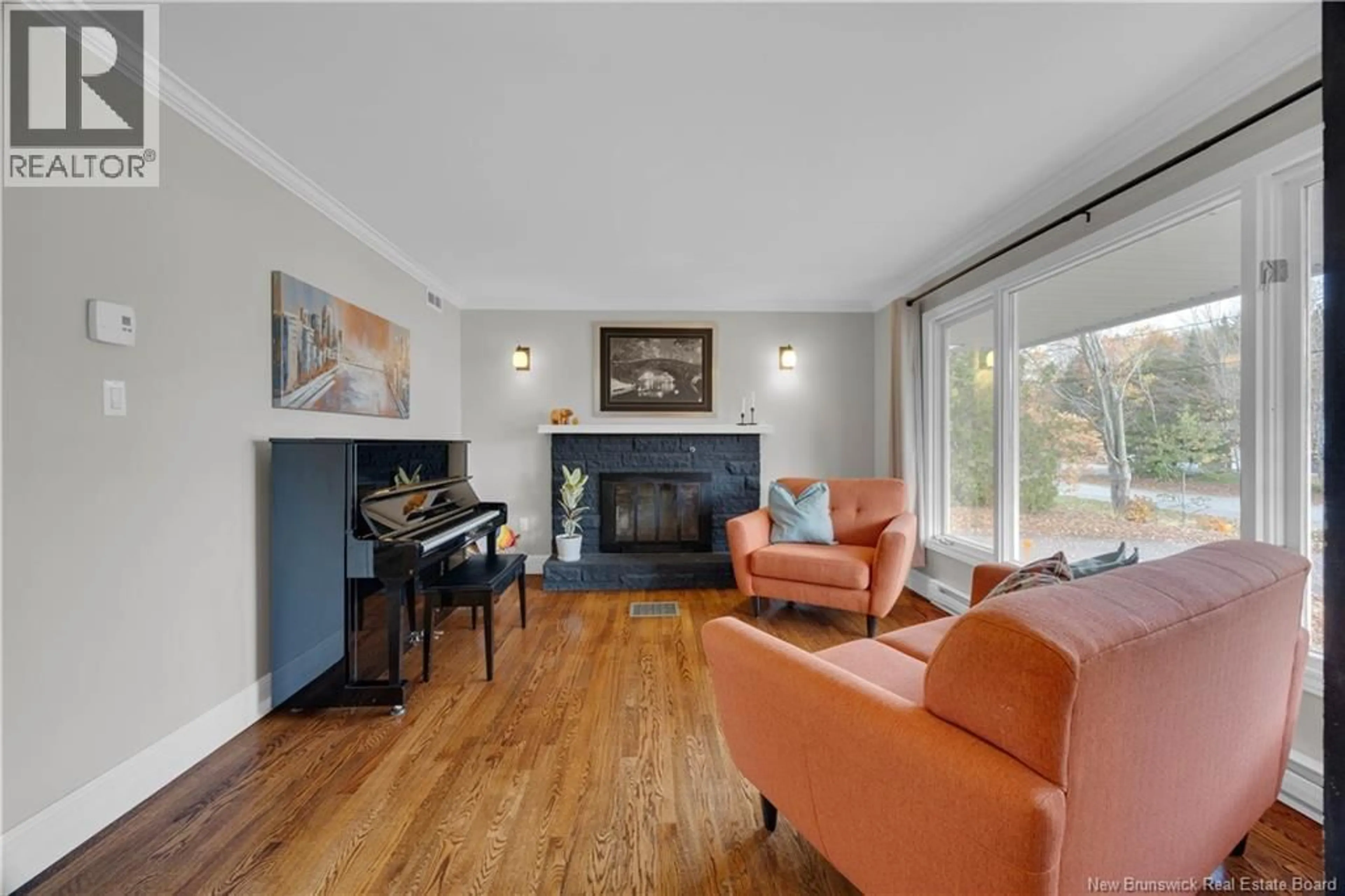 Living room with furniture, wood/laminate floor for 264 JOHNSTON ROAD, Saint John New Brunswick E2N1M6