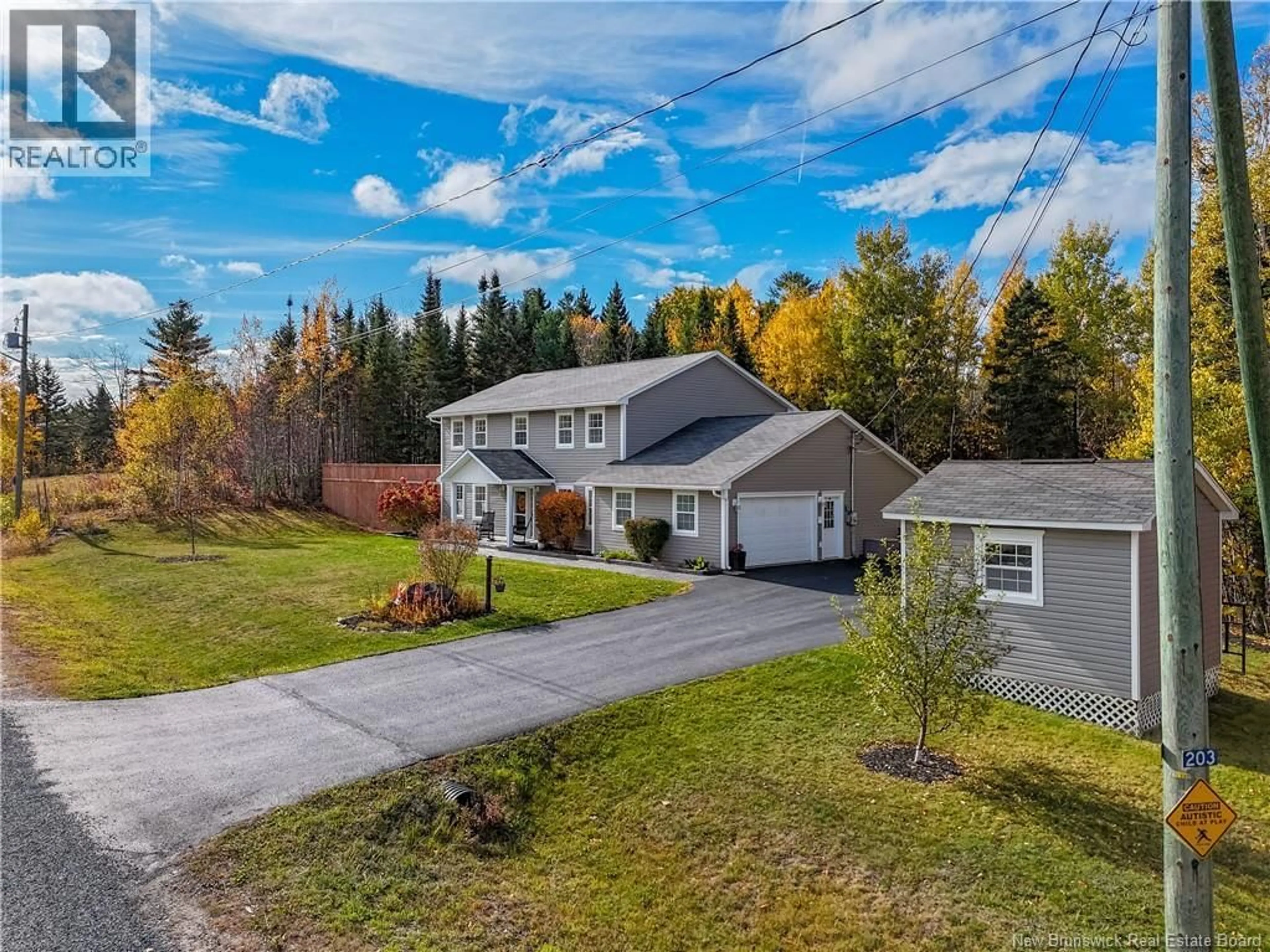 A pic from outside/outdoor area/front of a property/back of a property/a pic from drone, unknown for 203 GREEN AVENUE, Hanwell New Brunswick E3C0A7