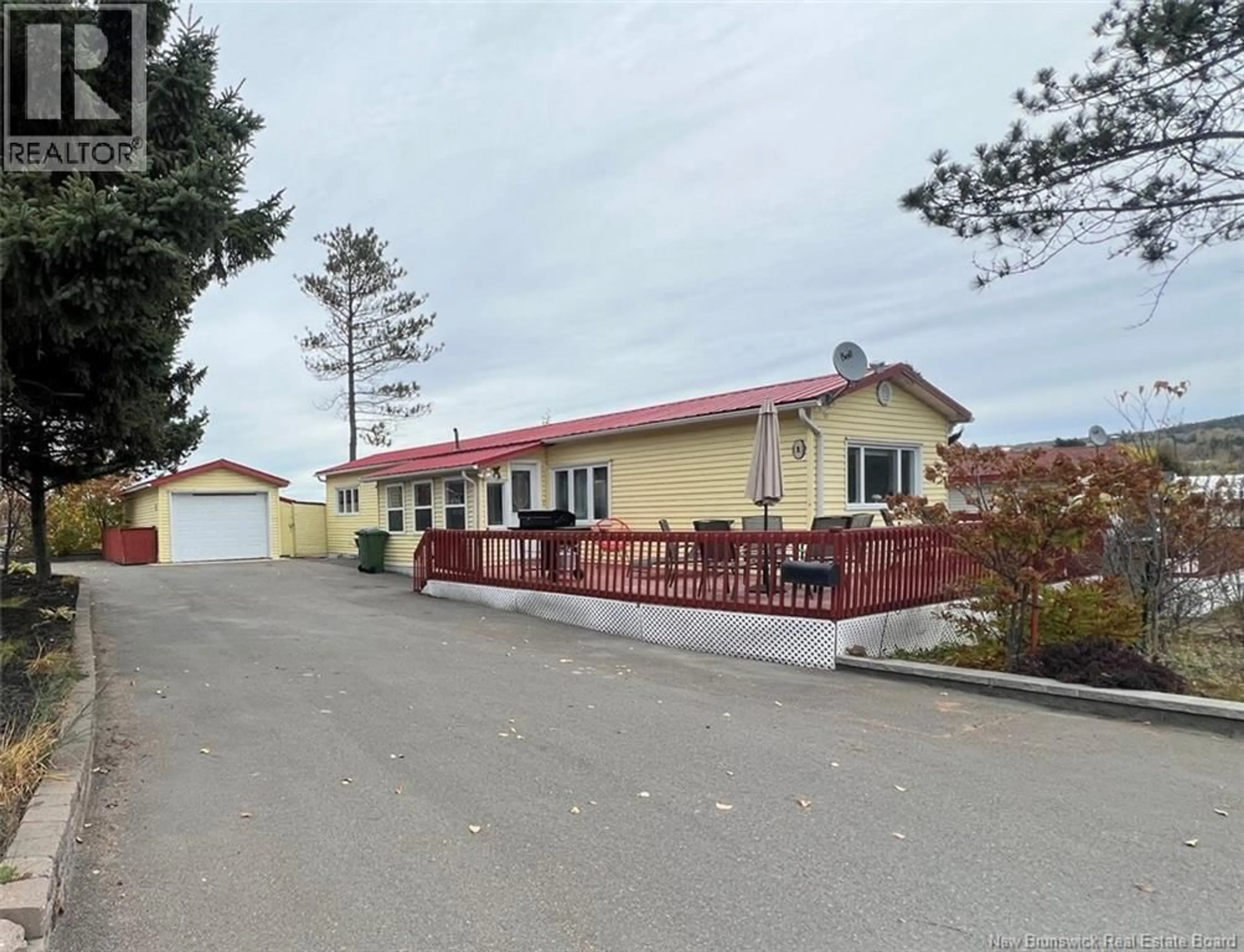 A pic from outside/outdoor area/front of a property/back of a property/a pic from drone, street for 1 PARC P'TISO STREET, Edmundston New Brunswick E3V3X7