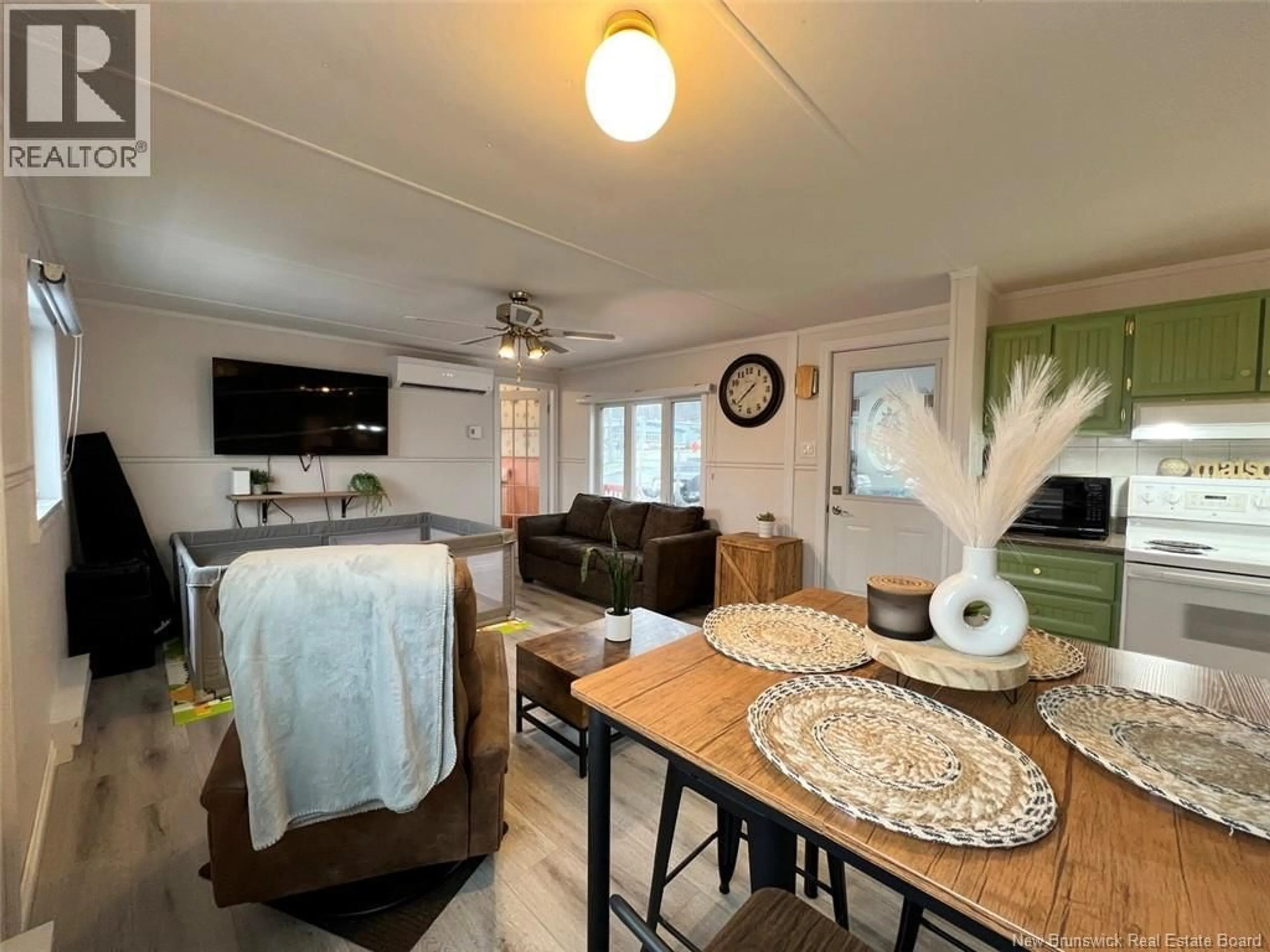 Living room with furniture, unknown for 1 PARC P'TISO STREET, Edmundston New Brunswick E3V3X7