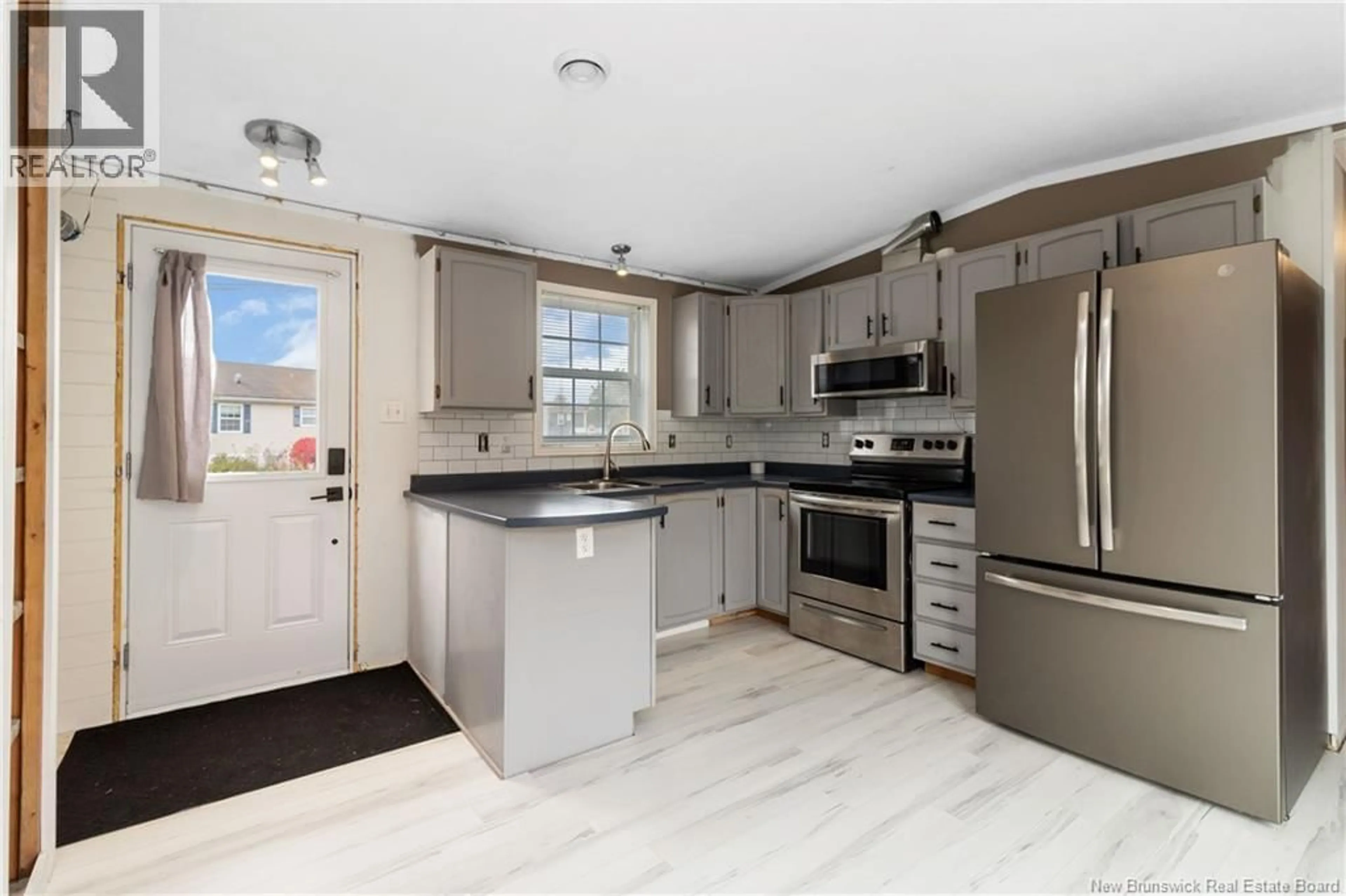 Open concept kitchen, ceramic/tile floor for 50 SOPHIE, Dieppe New Brunswick E1A7C7