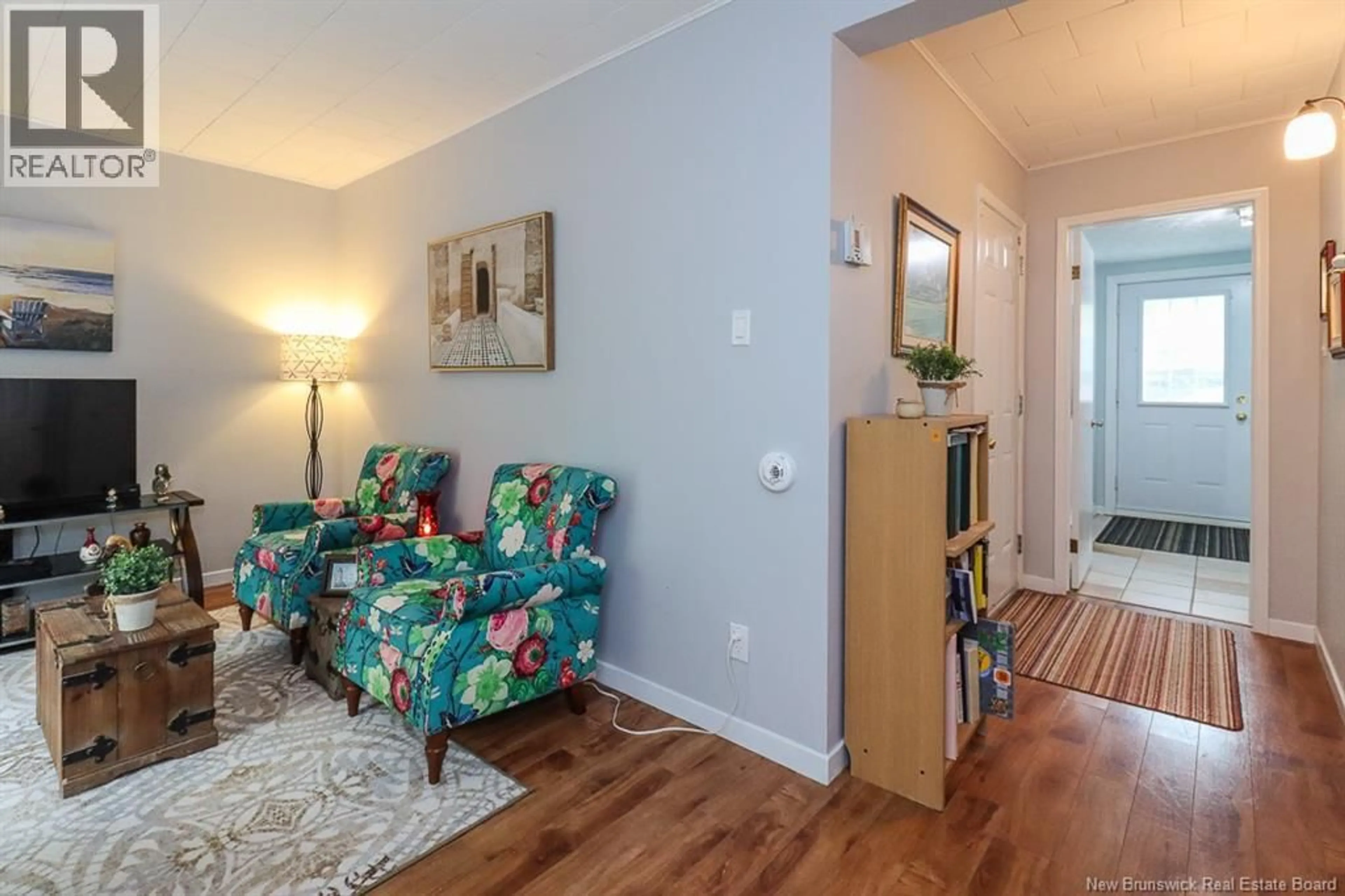 Living room with furniture, wood/laminate floor for 15 HILLSVIEW CRESCENT, Rothesay New Brunswick E2E3N5