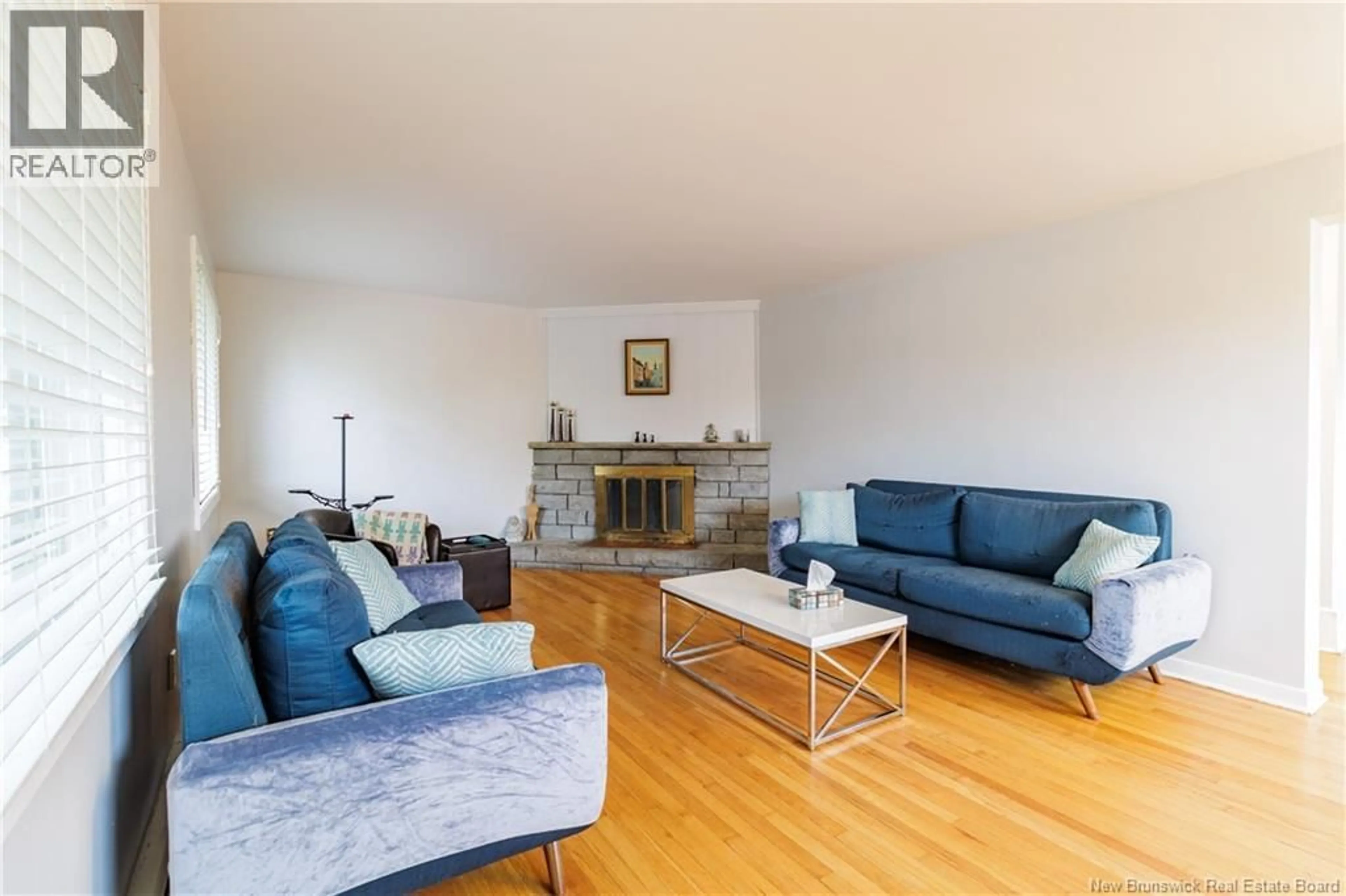 Living room with furniture, wood/laminate floor for 887 YORK STREET, Fredericton New Brunswick E3B3R9