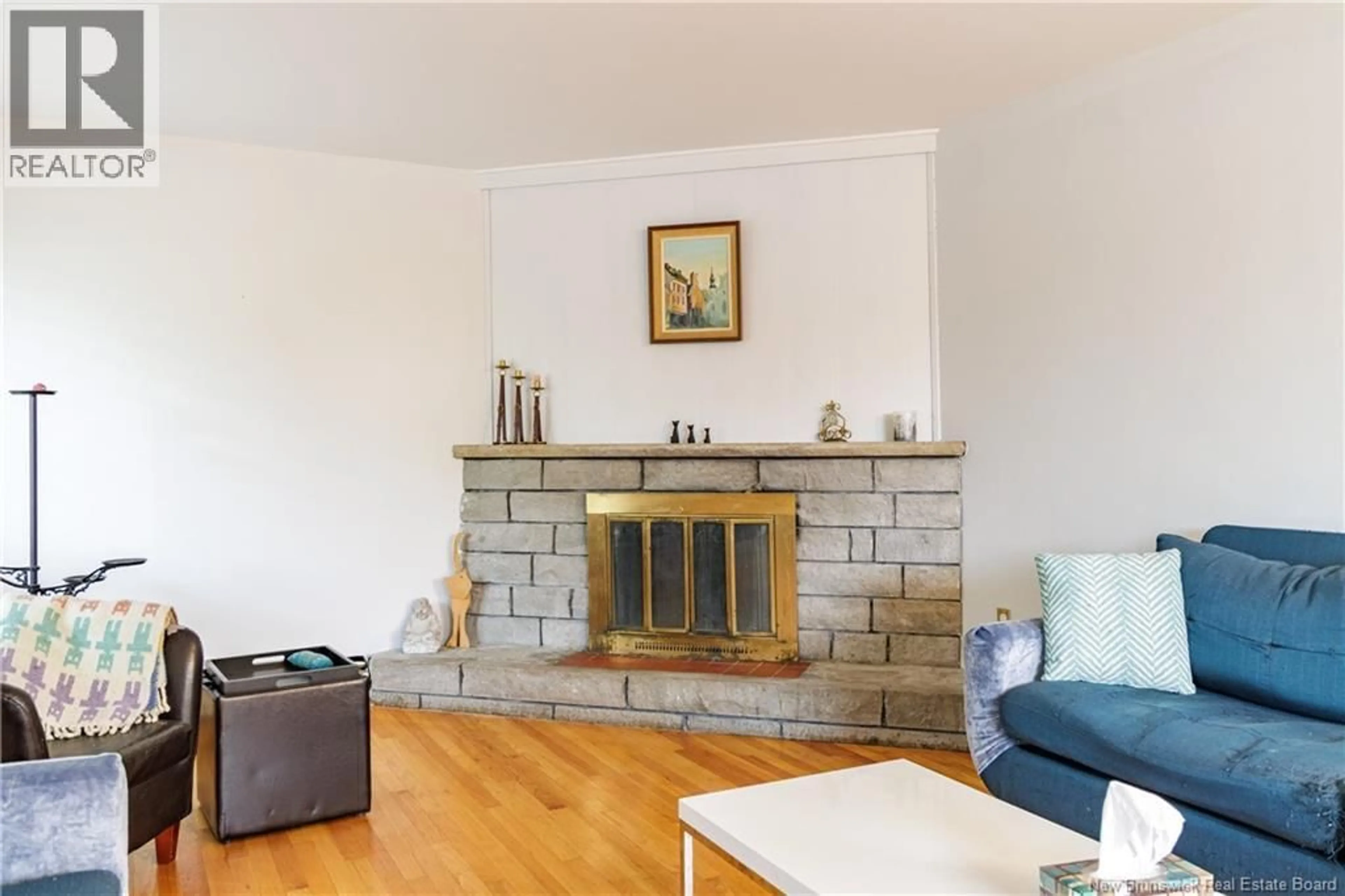 Living room with furniture, wood/laminate floor for 887 YORK STREET, Fredericton New Brunswick E3B3R9