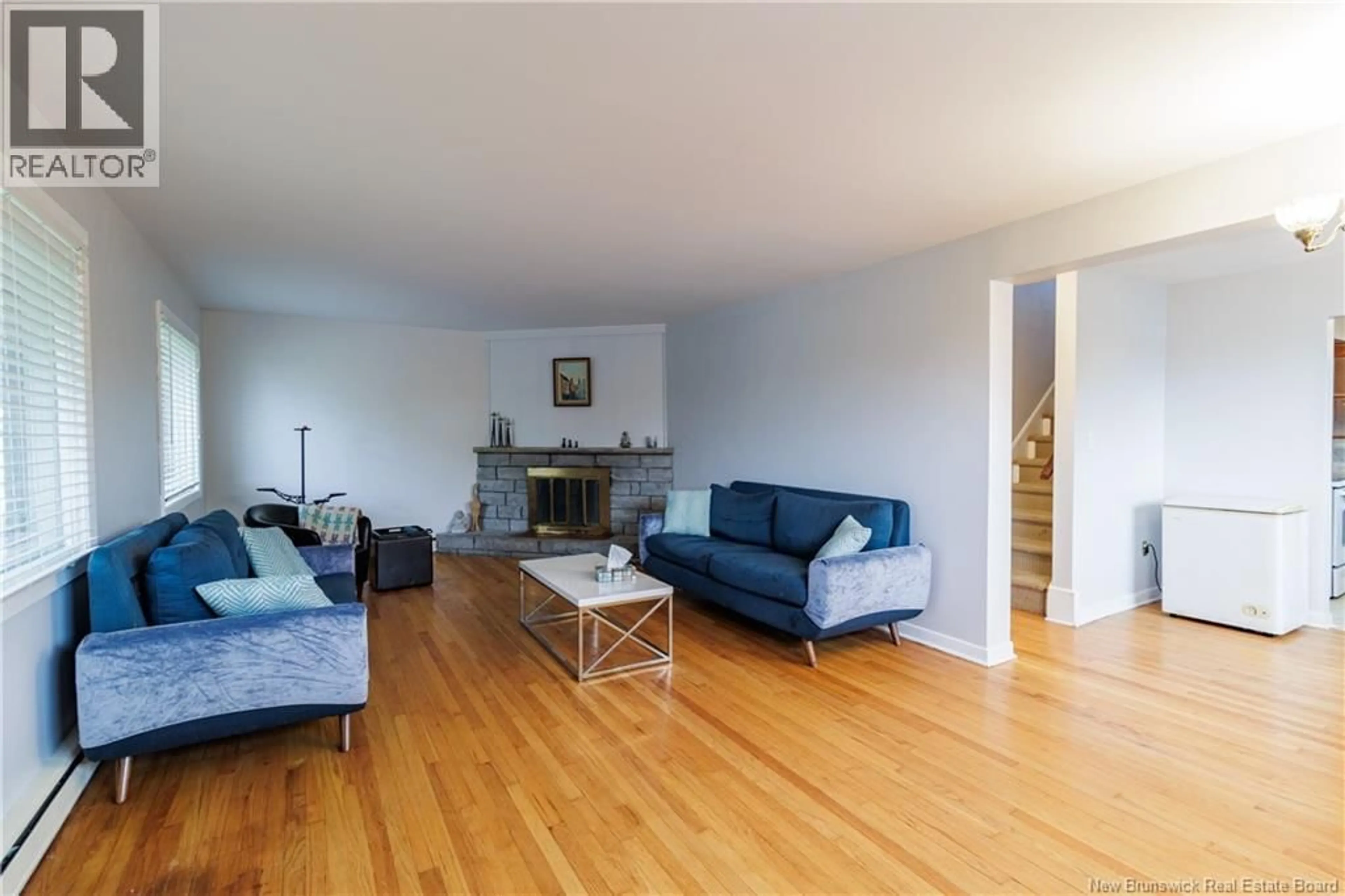 Living room with furniture, wood/laminate floor for 887 YORK STREET, Fredericton New Brunswick E3B3R9