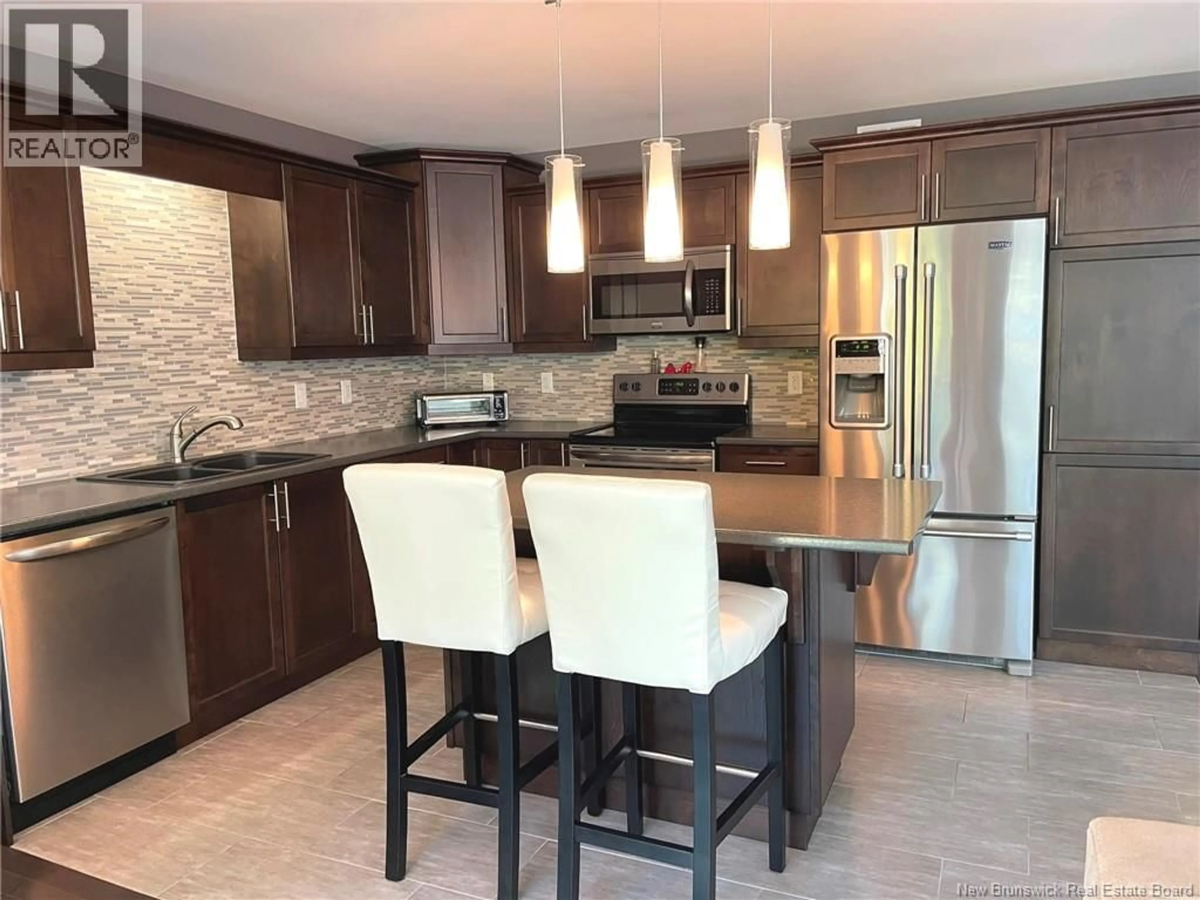 Open concept kitchen, ceramic/tile floor for 371 DOLBEAU STREET, Dieppe New Brunswick E1A9P9
