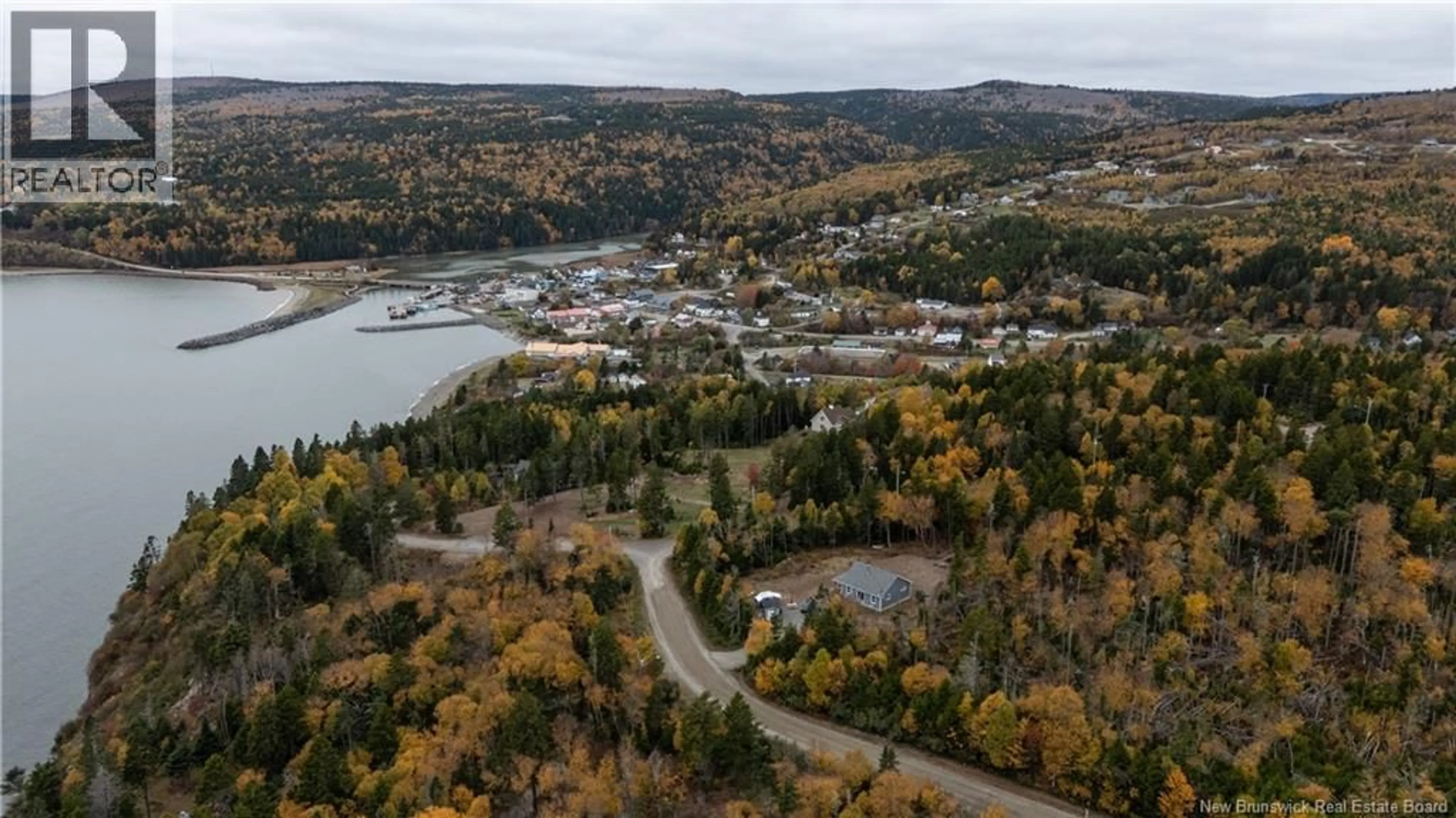 A pic from outside/outdoor area/front of a property/back of a property/a pic from drone, water/lake/river/ocean view for 39 CHIGNECTO DRIVE, Alma New Brunswick E4H1V9