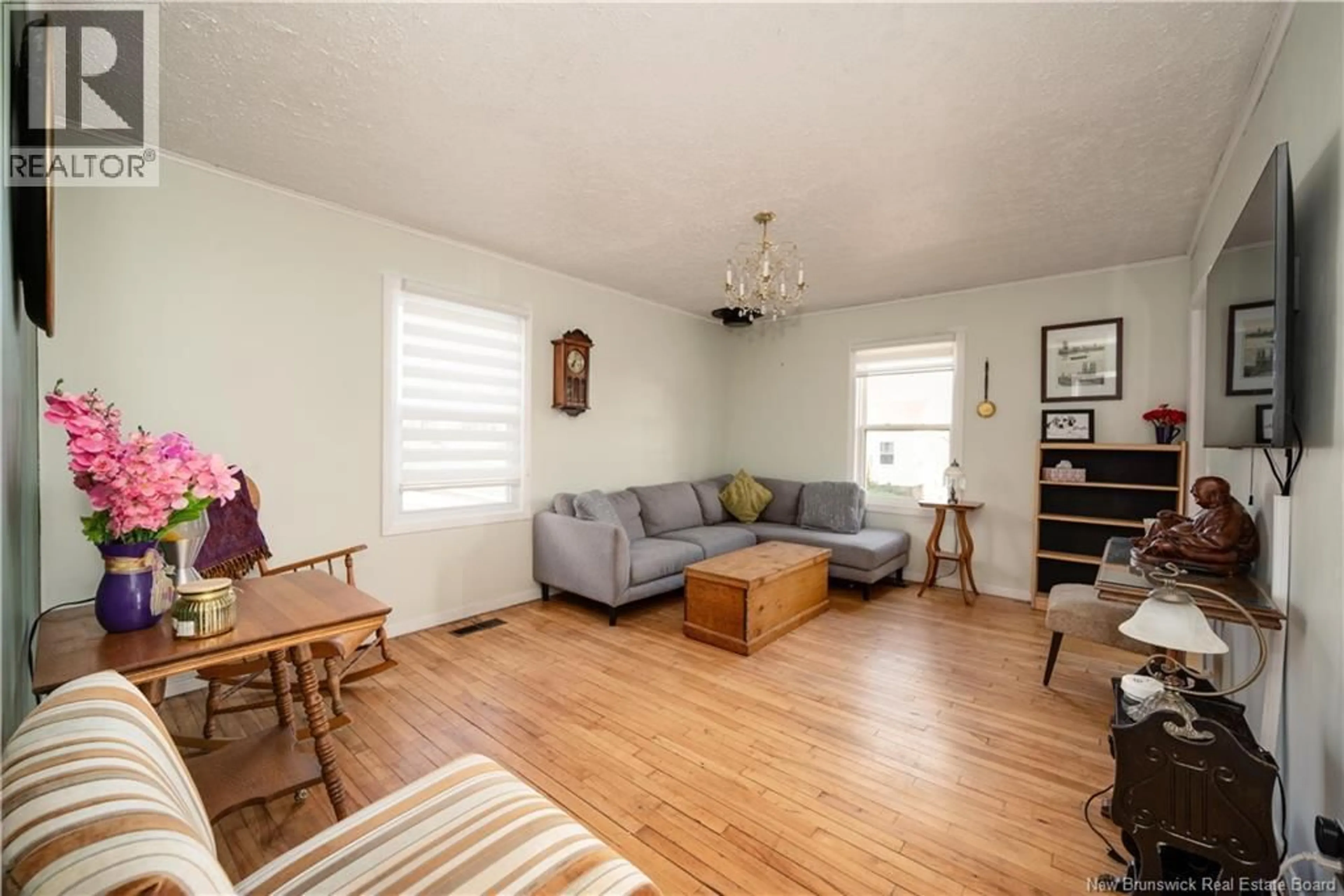 Living room with furniture, wood/laminate floor for 29 COPP STREET, Dieppe New Brunswick E1A2G9