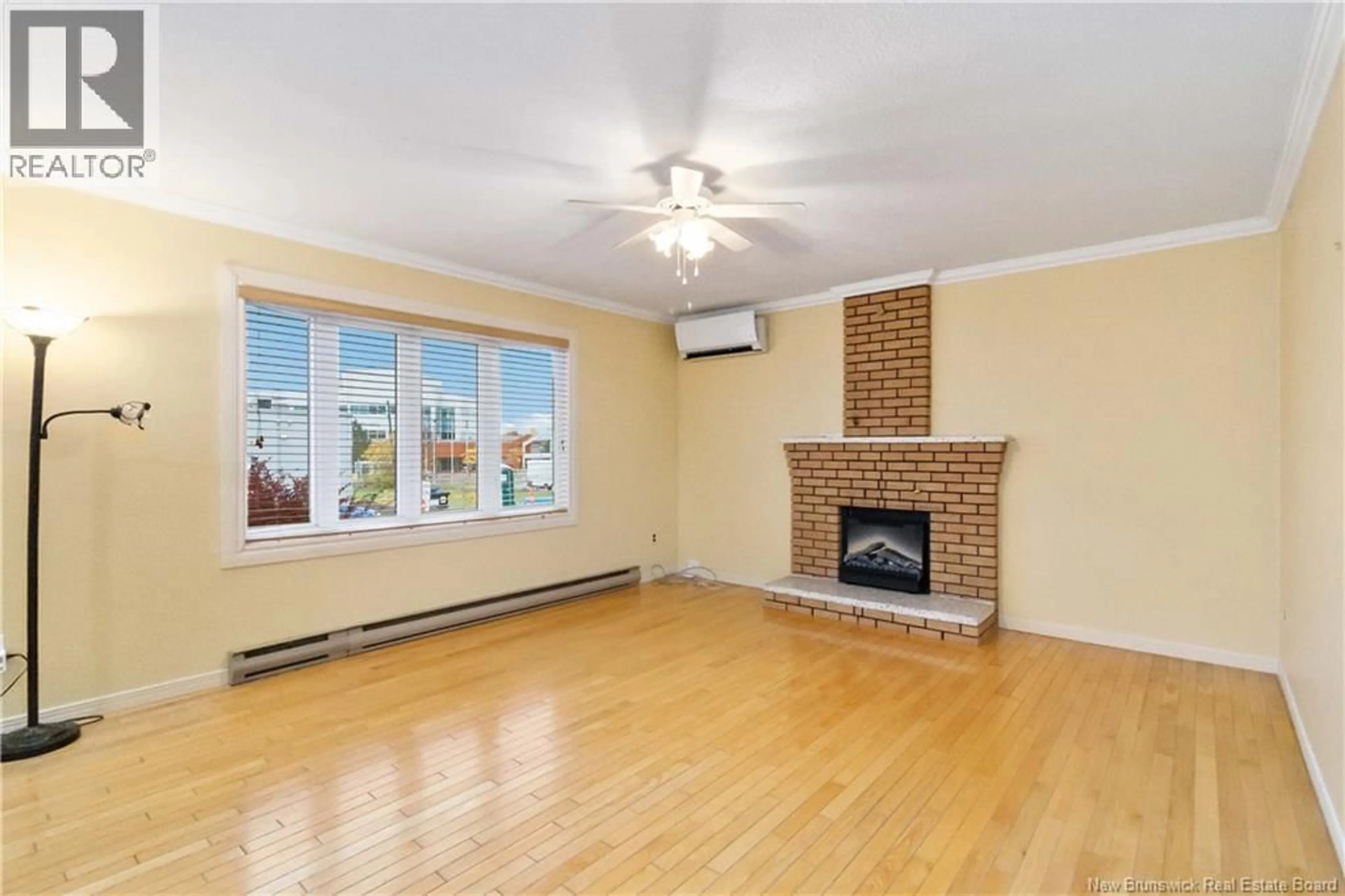 Living room with furniture, wood/laminate floor for 207 ST LAURENT STREET, Dieppe New Brunswick E1A1S2