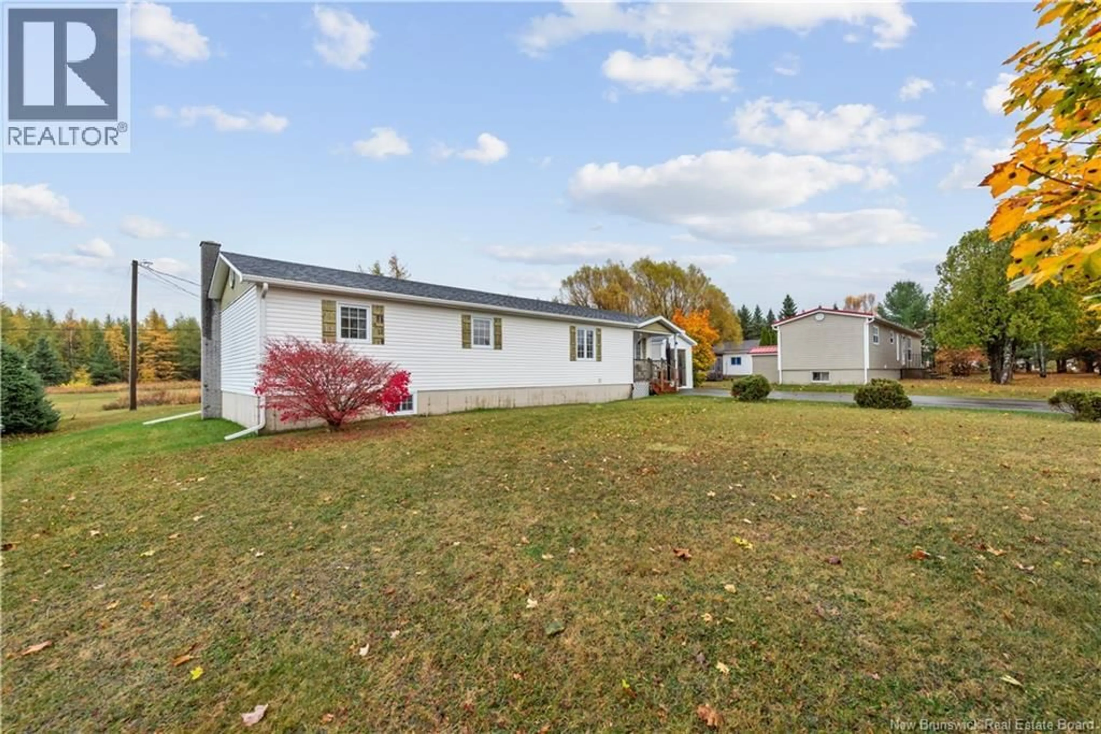 A pic from outside/outdoor area/front of a property/back of a property/a pic from drone, unknown for 15 RUE THIBODEAU, Rogersville New Brunswick E4Y1S9