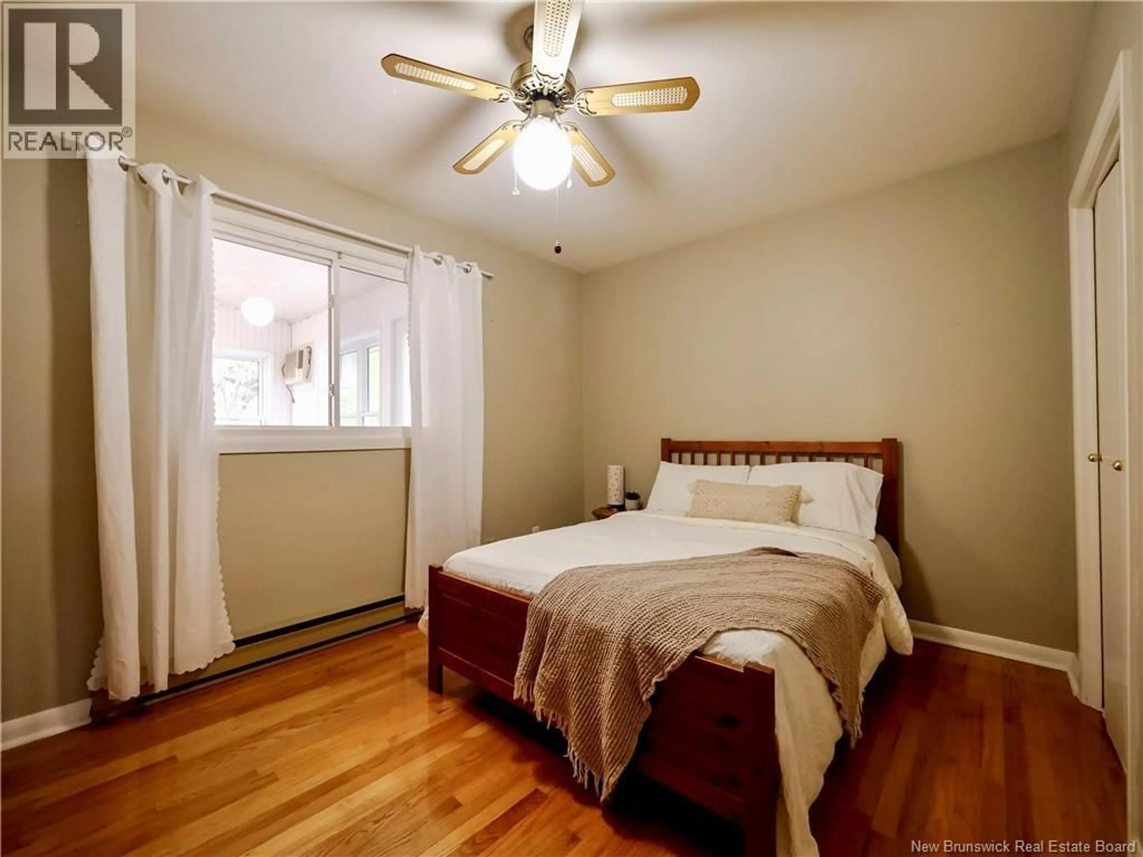 Bedroom with bed, wood/laminate floor for 107 CARNEY, Moncton New Brunswick E1C4J1