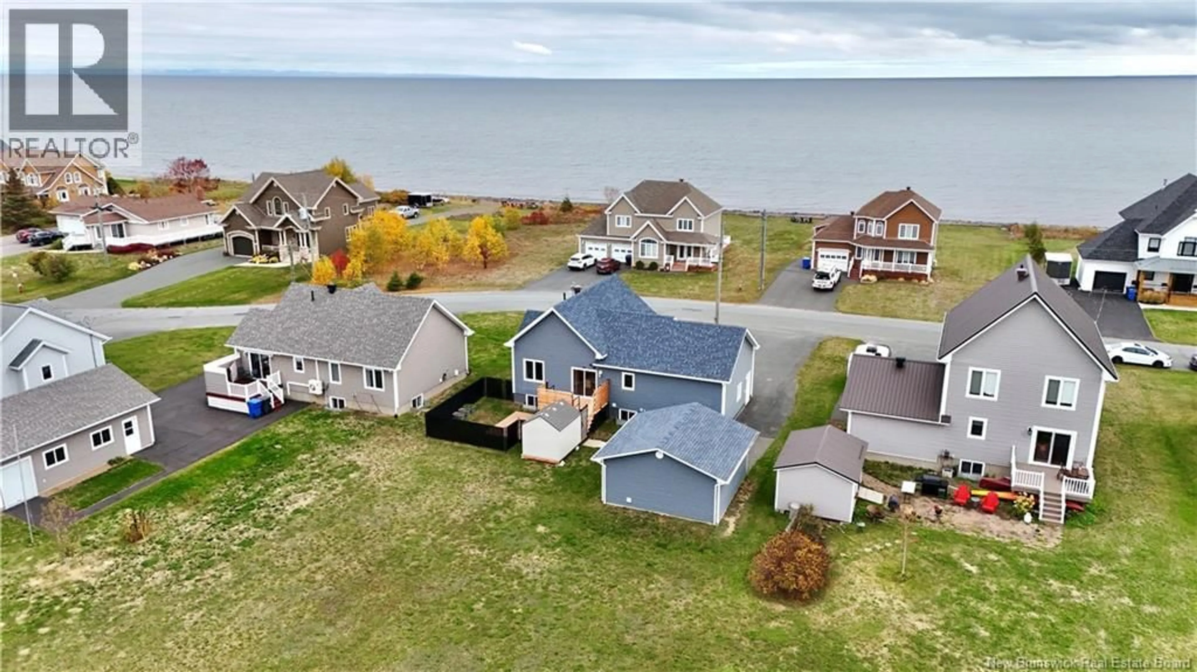 A pic from outside/outdoor area/front of a property/back of a property/a pic from drone, water/lake/river/ocean view for 656 BAIE, Beresford New Brunswick E8K1X2