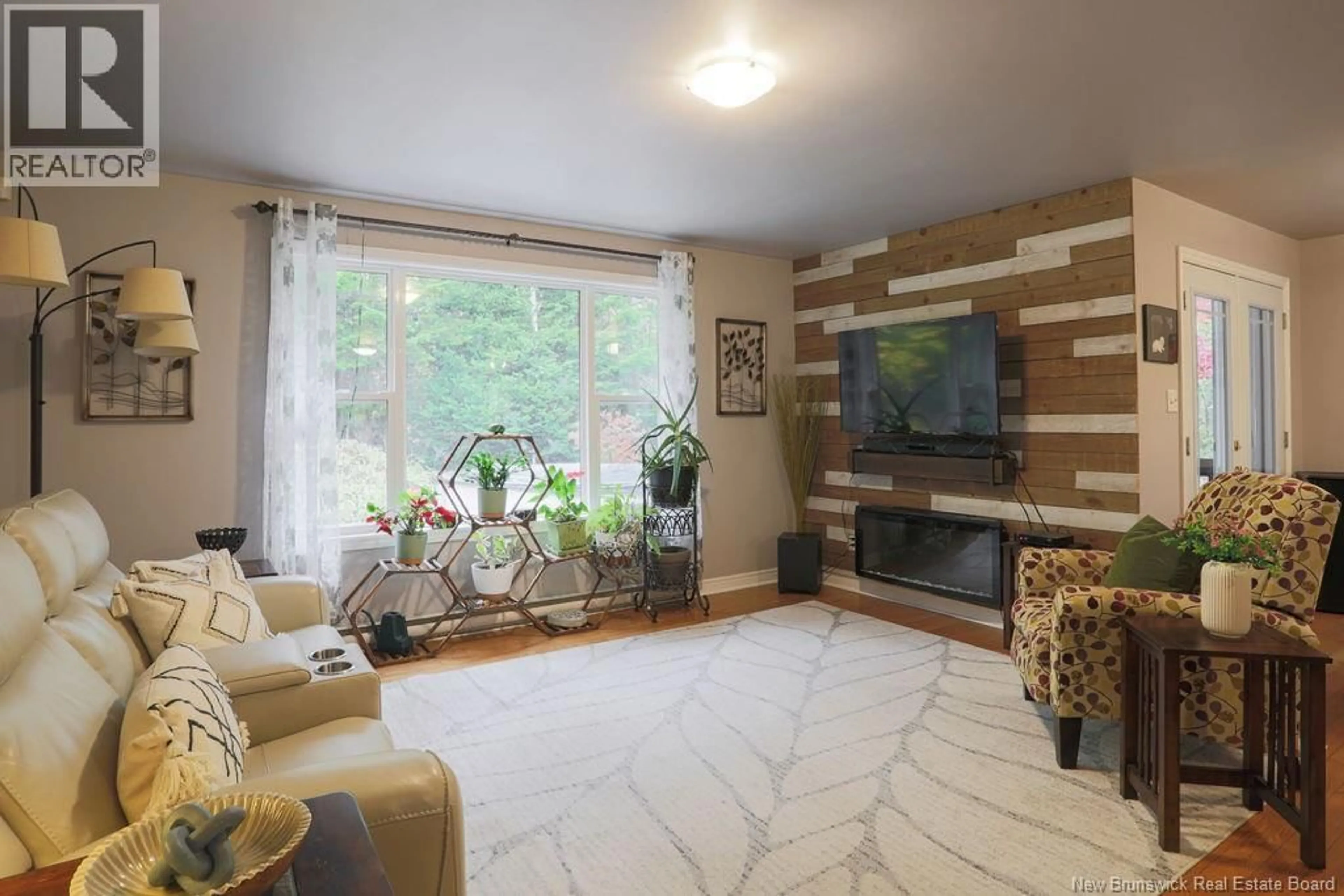 Living room with furniture, wood/laminate floor for 25 SPRING GARDEN ROAD, Saint John New Brunswick E2K1N4