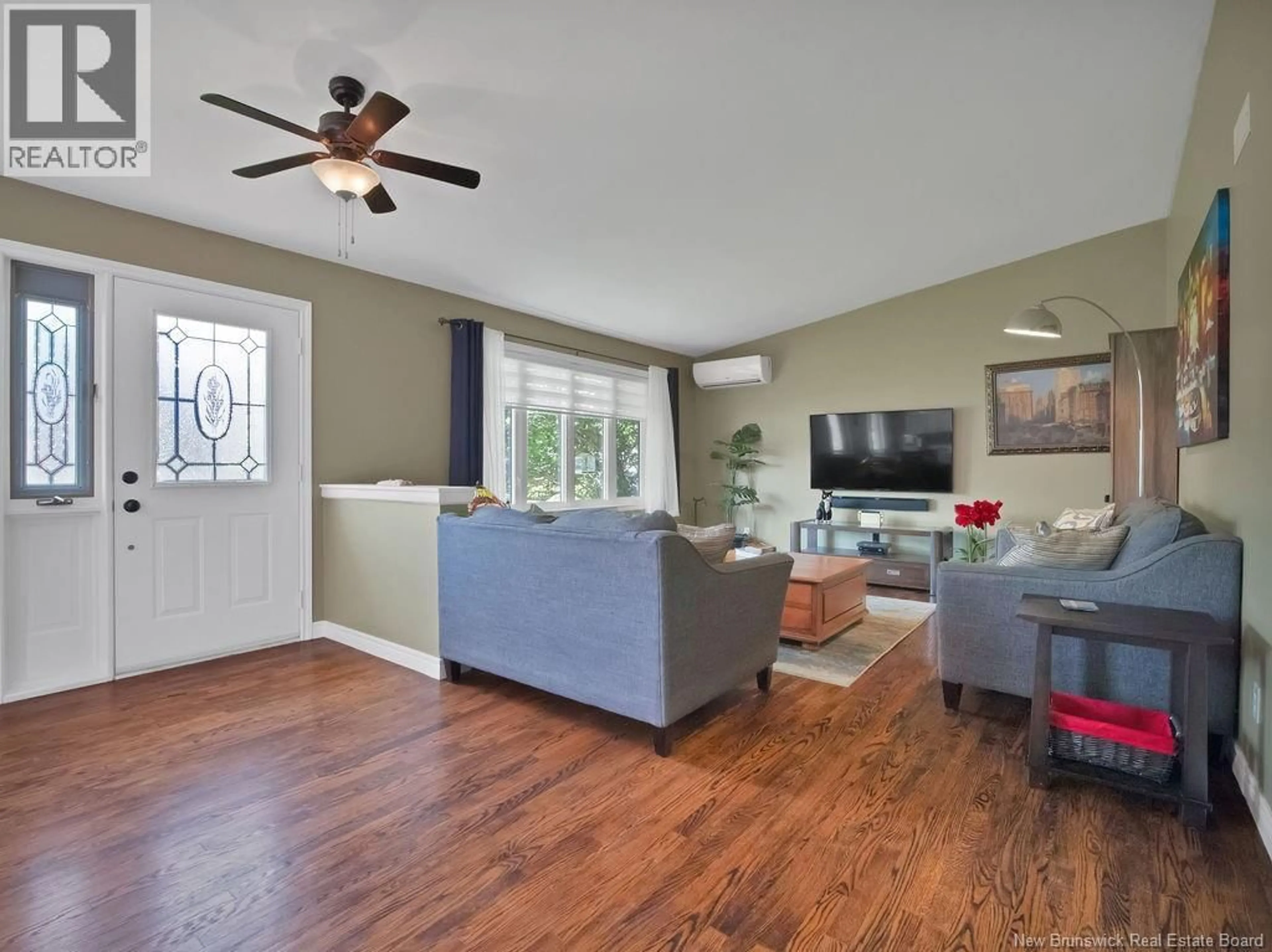 Living room with furniture, wood/laminate floor for 938 MELANSON ROAD, Dieppe New Brunswick E1A7N9