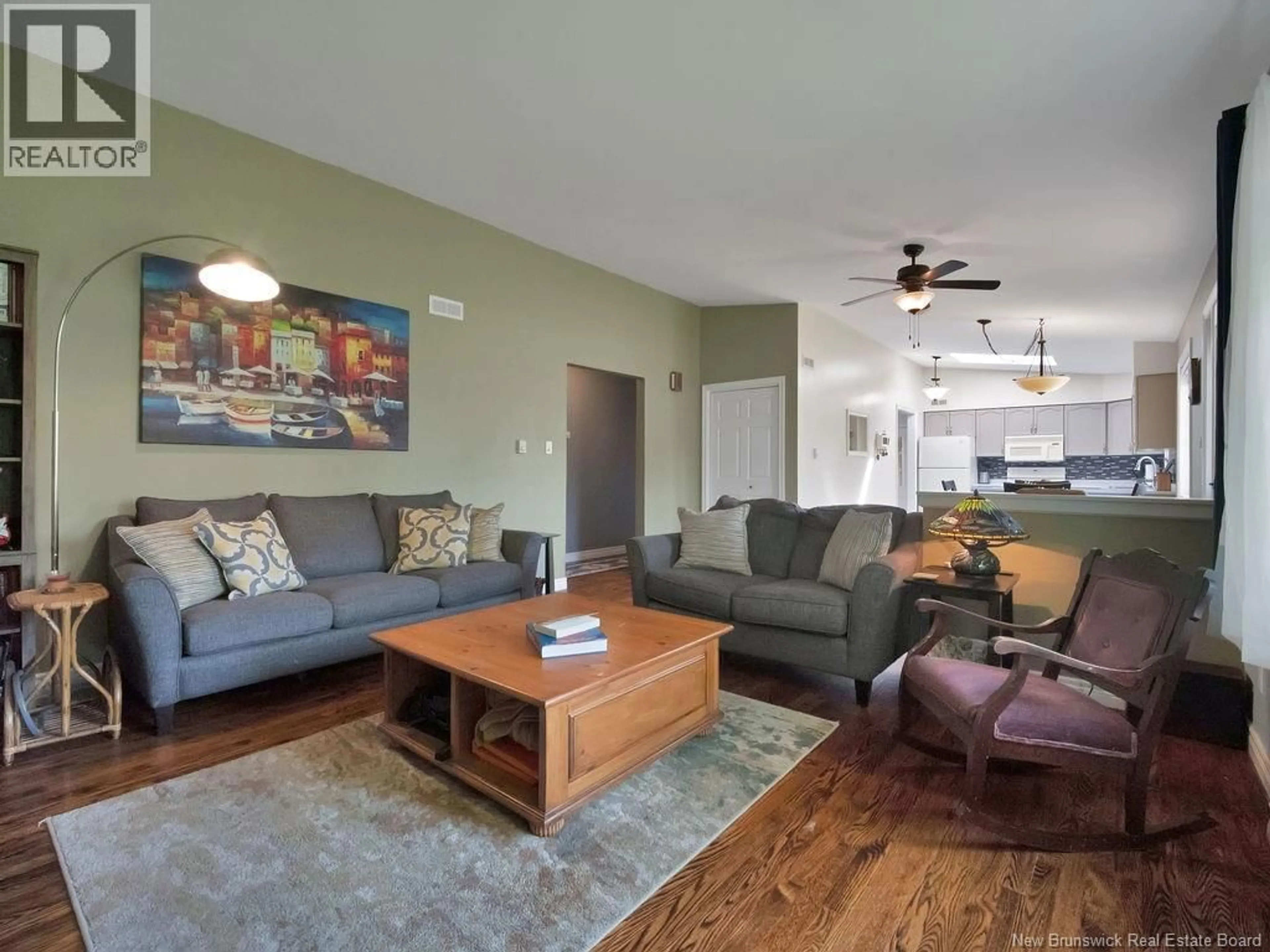 Living room with furniture, wood/laminate floor for 938 MELANSON ROAD, Dieppe New Brunswick E1A7N9
