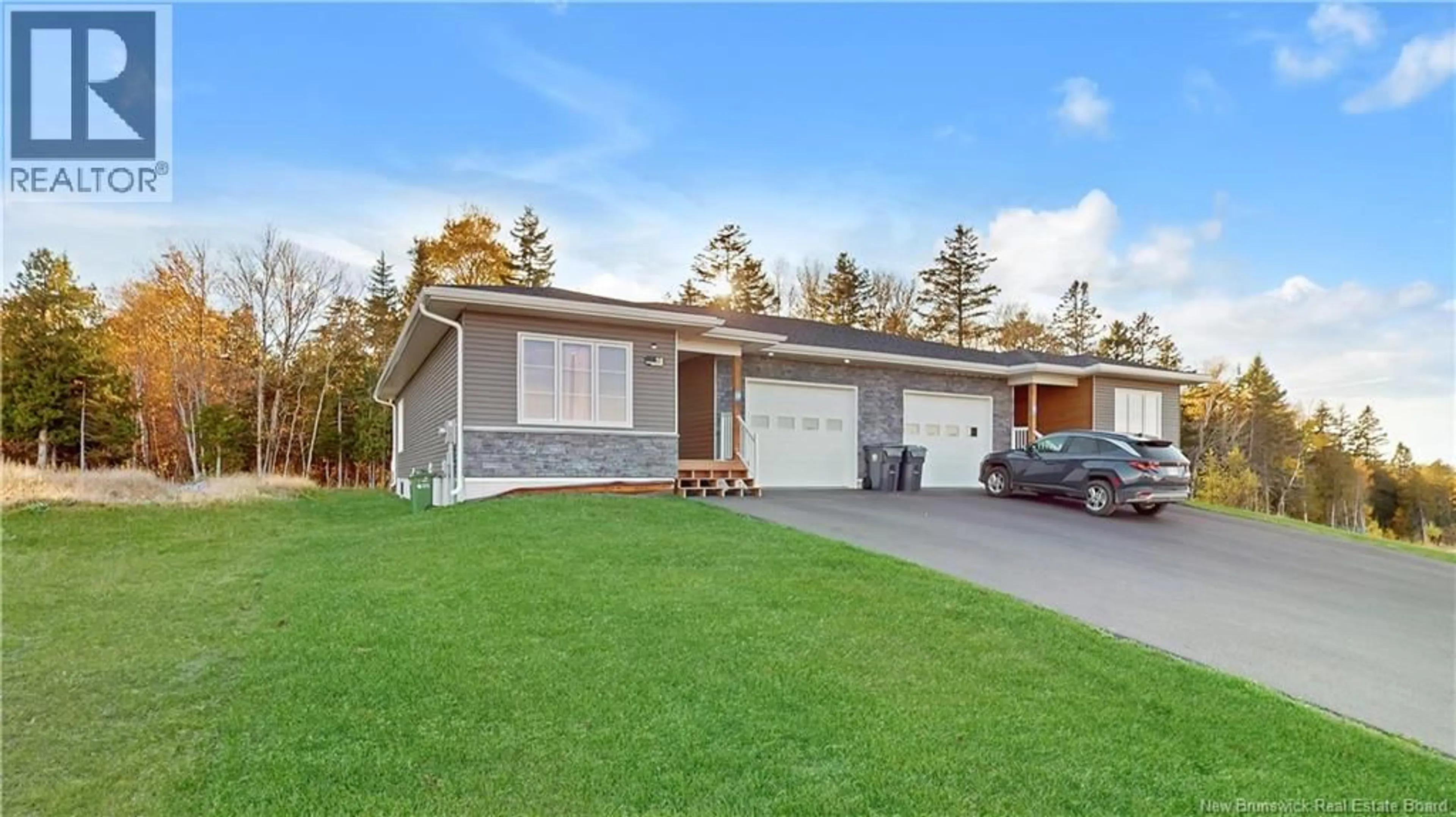 Home with vinyl exterior material, street for 18 ELMWOOD DRIVE, Hampton New Brunswick E5N0P9
