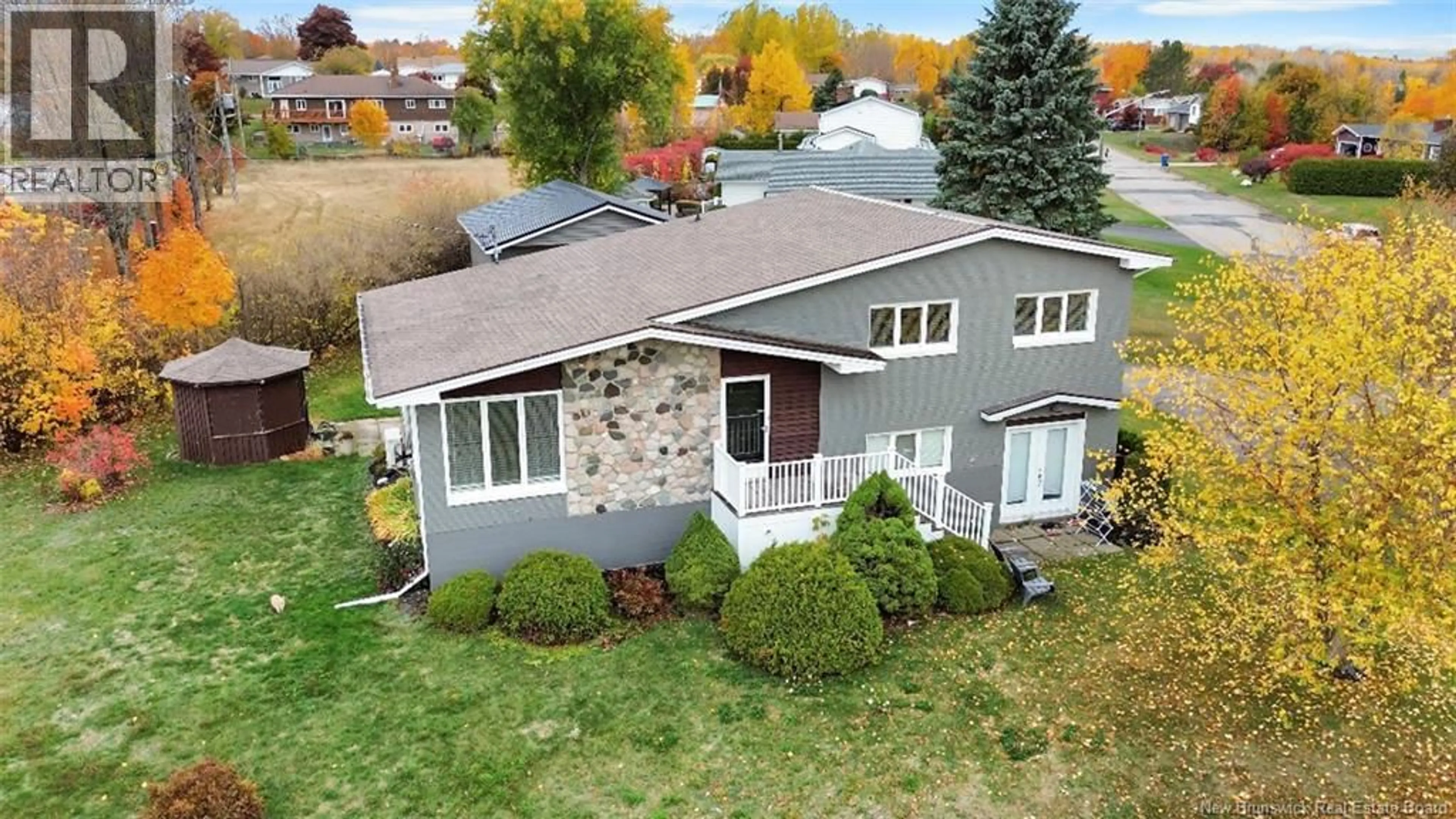 A pic from outside/outdoor area/front of a property/back of a property/a pic from drone, street for 125 ROCHE, Bathurst New Brunswick E2A3E5