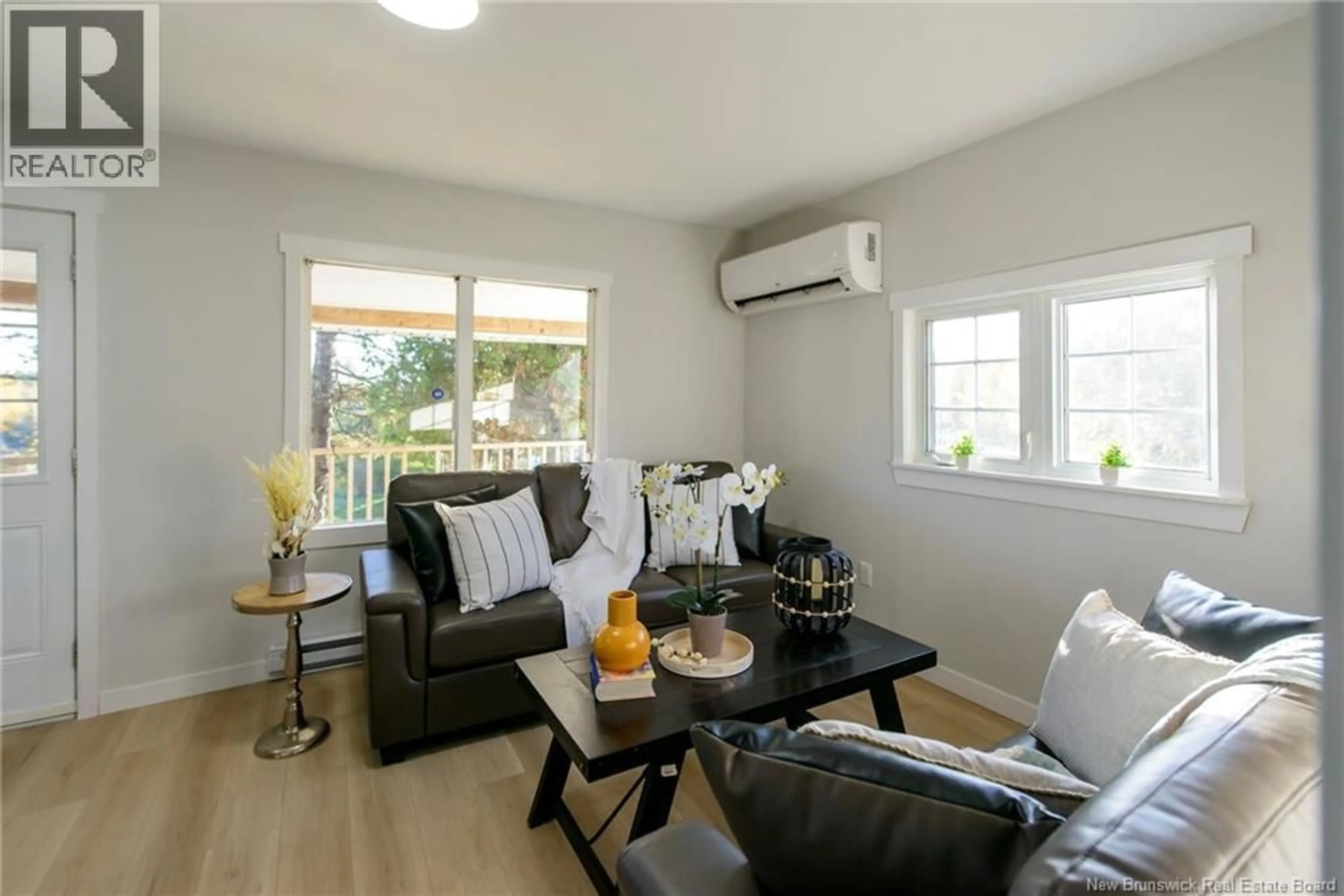 Living room with furniture, wood/laminate floor for 120 SANDY POINT ROAD, Saint John New Brunswick E2K3R8