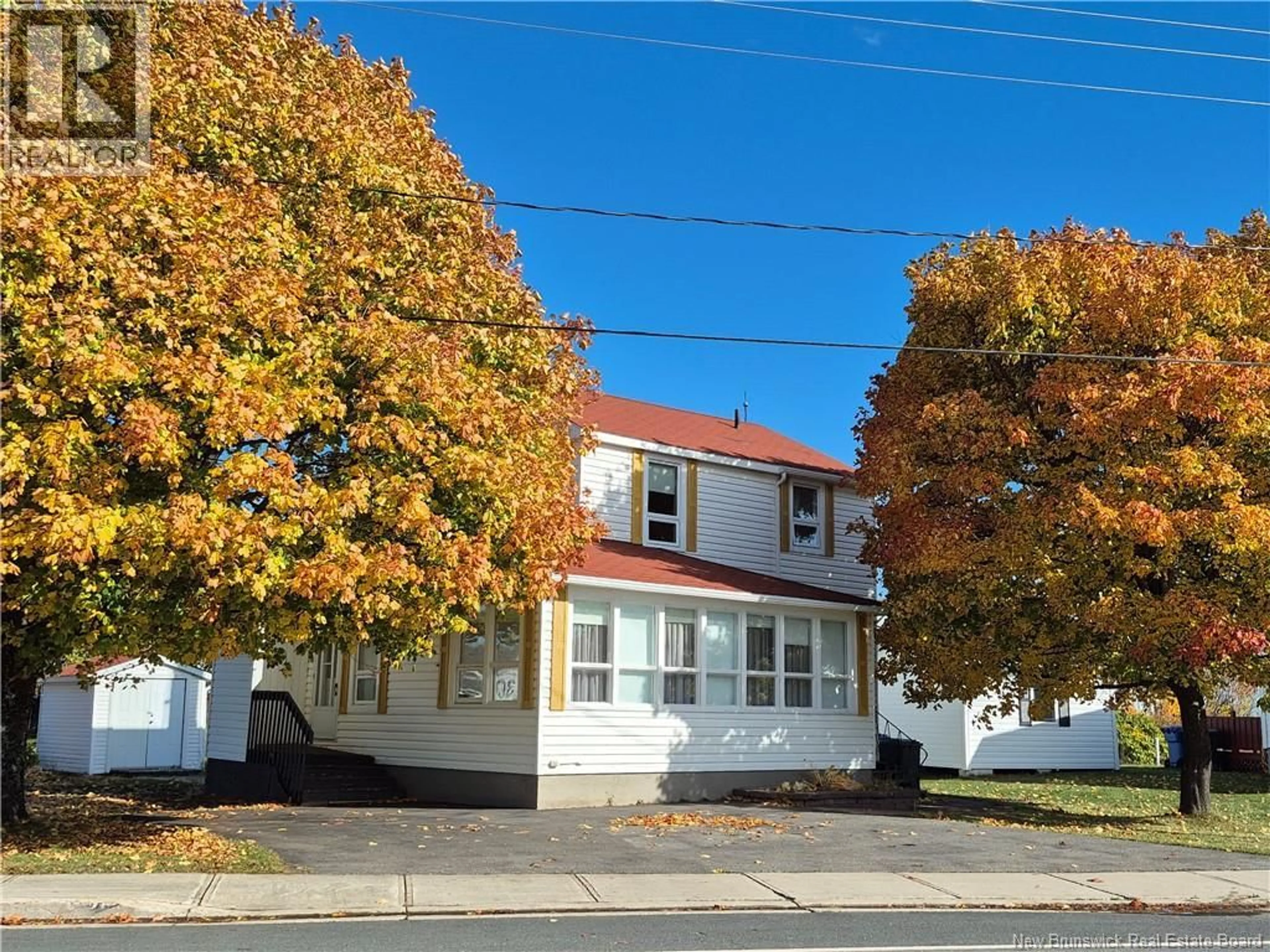 Home with vinyl exterior material, street for 294 J.D GAUTHIER BOULEVARD, Shippagan New Brunswick E8S1R4