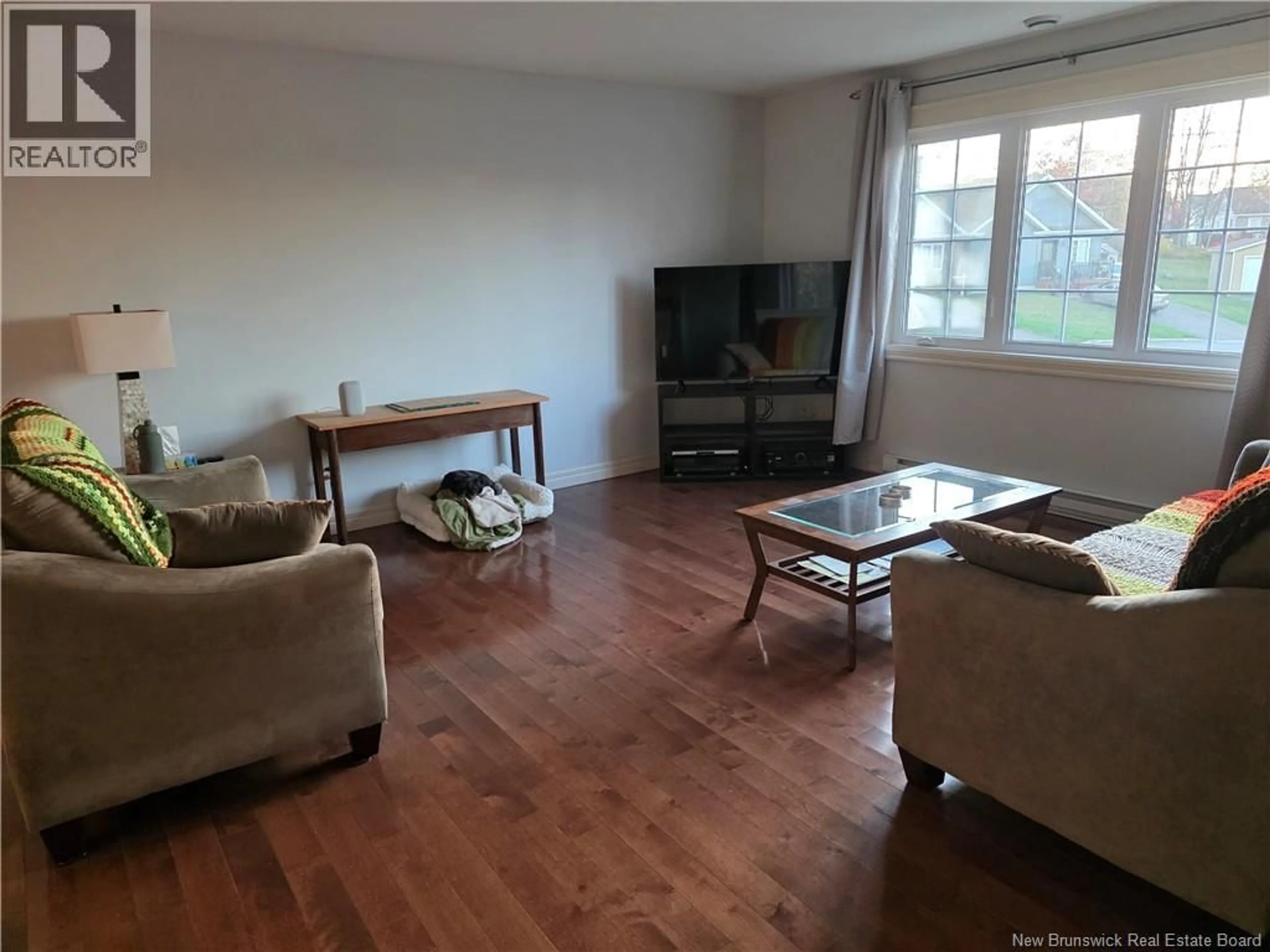 Living room with furniture, wood/laminate floor for 9 JEREMIE COURT, Moncton New Brunswick E1A0B7