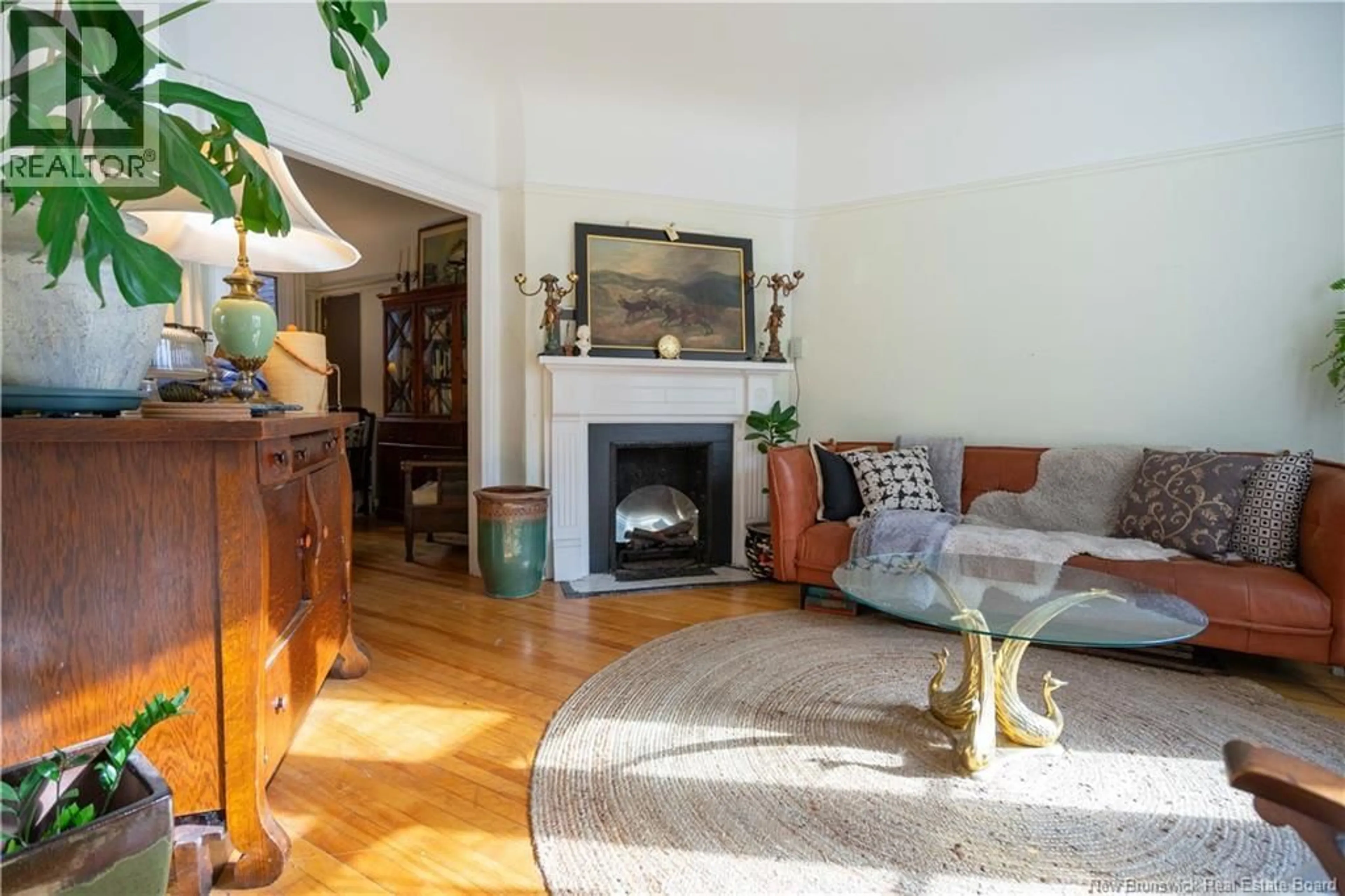 Living room with furniture, wood/laminate floor for 83 SUMMER STREET, Saint John New Brunswick E2K3Y1