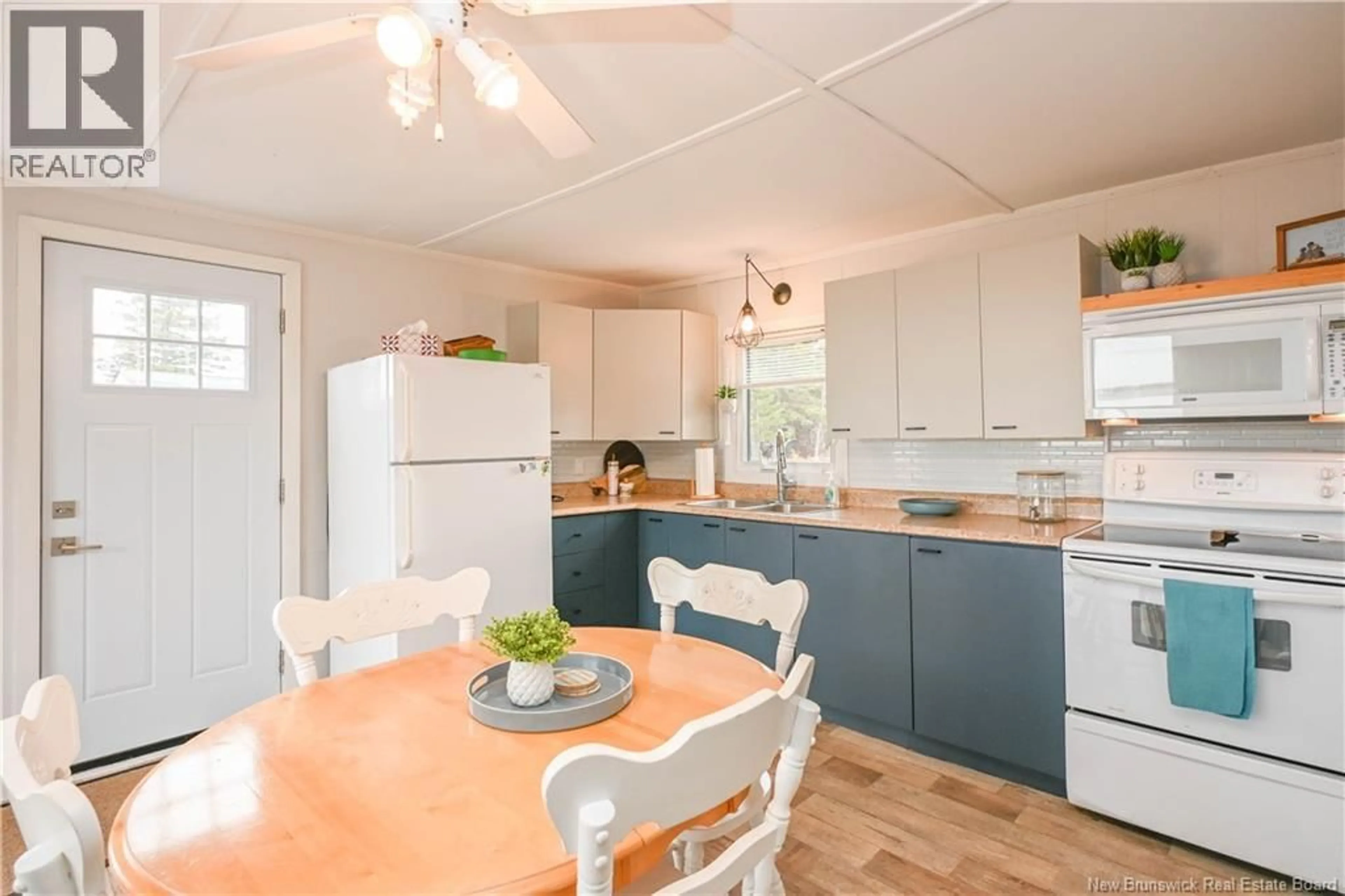 Open concept kitchen, wood/laminate floor for 27 - 29 BERTIE STREET, Val-Comeau New Brunswick E1X4J7