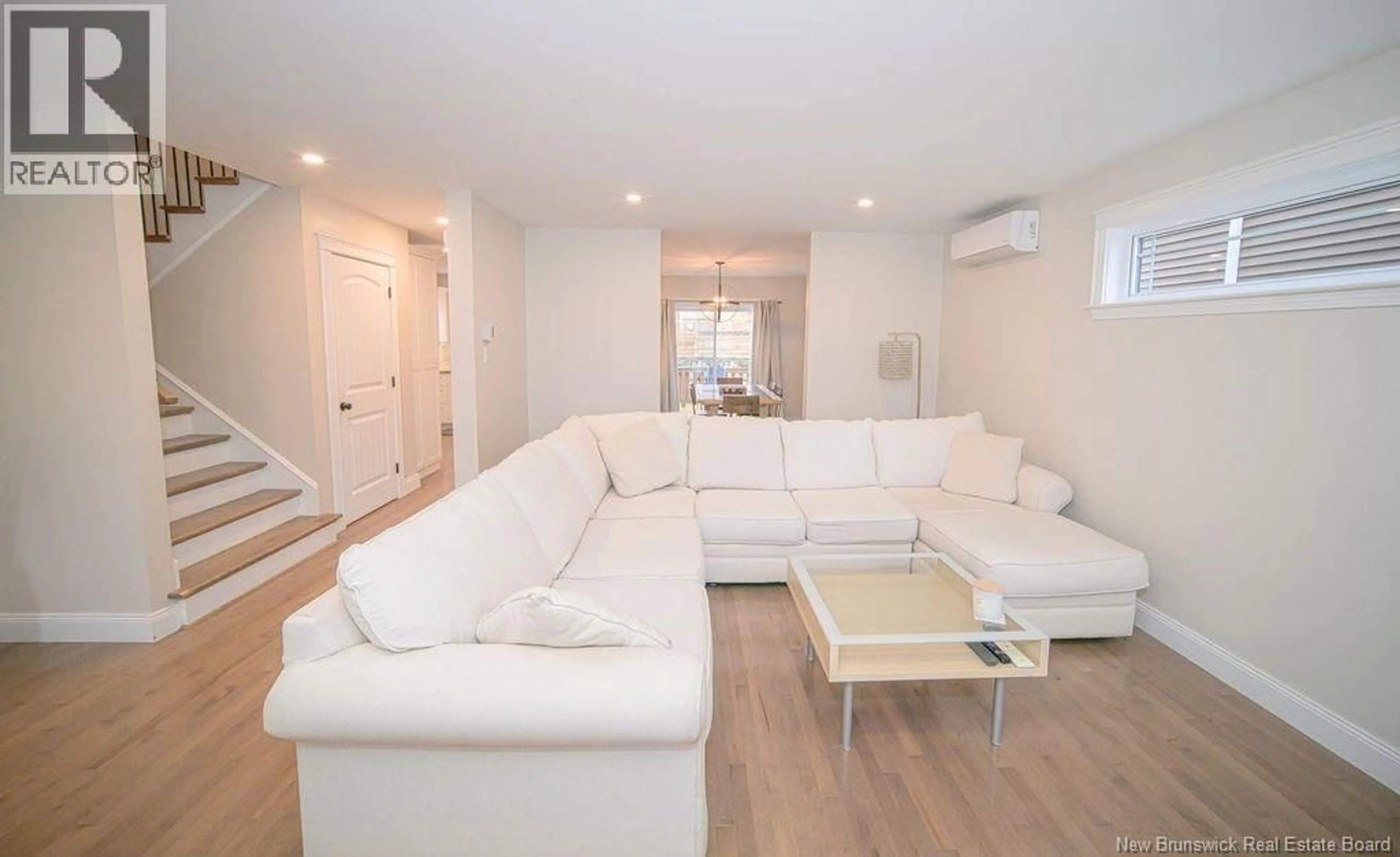 Living room with furniture, wood/laminate floor for 39 BRAMBLE WAY, Fredericton New Brunswick E3G0C8