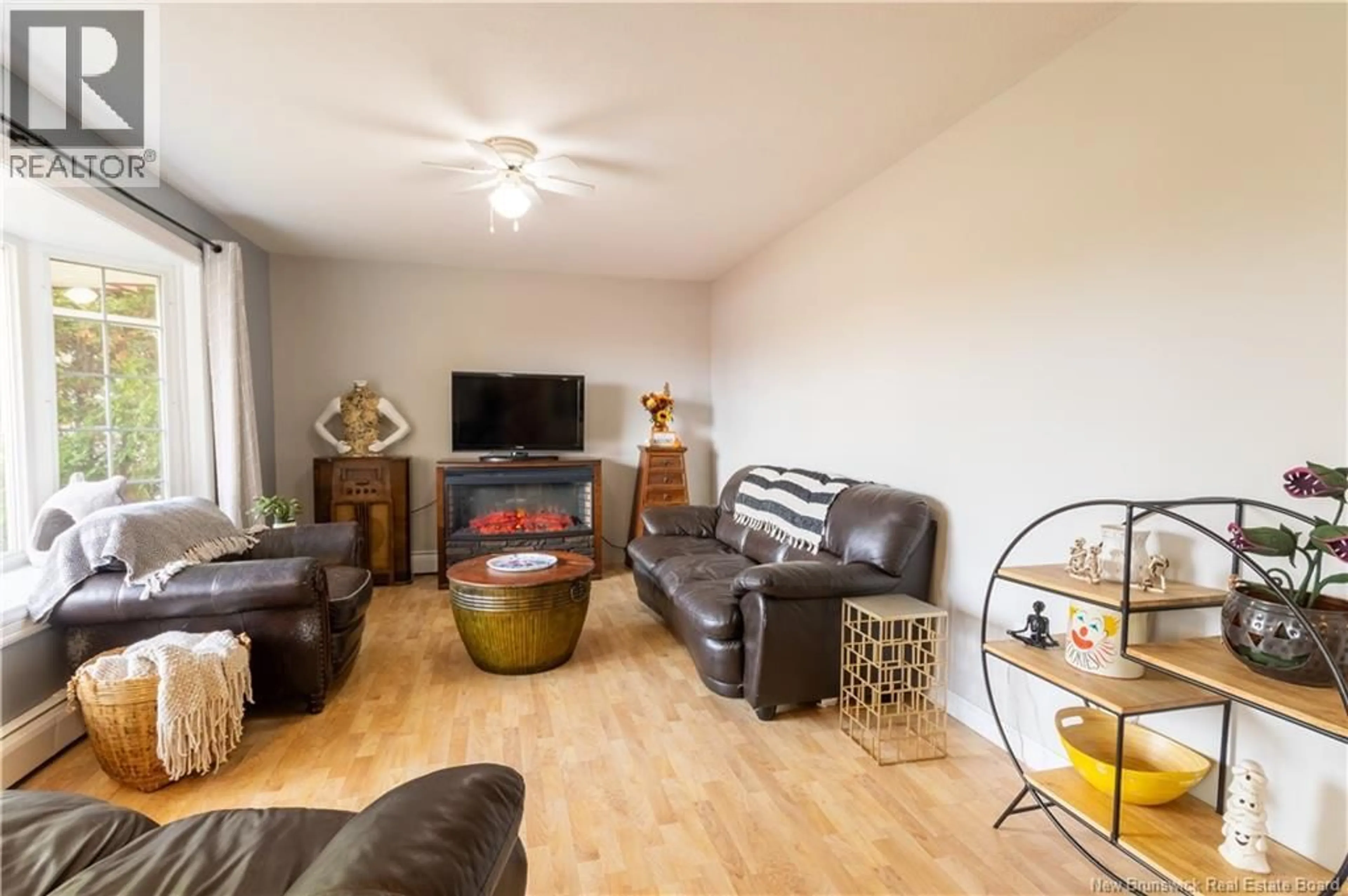 Living room with furniture, wood/laminate floor for 427 HOLDEN STREET, Oromocto New Brunswick E2V1G2