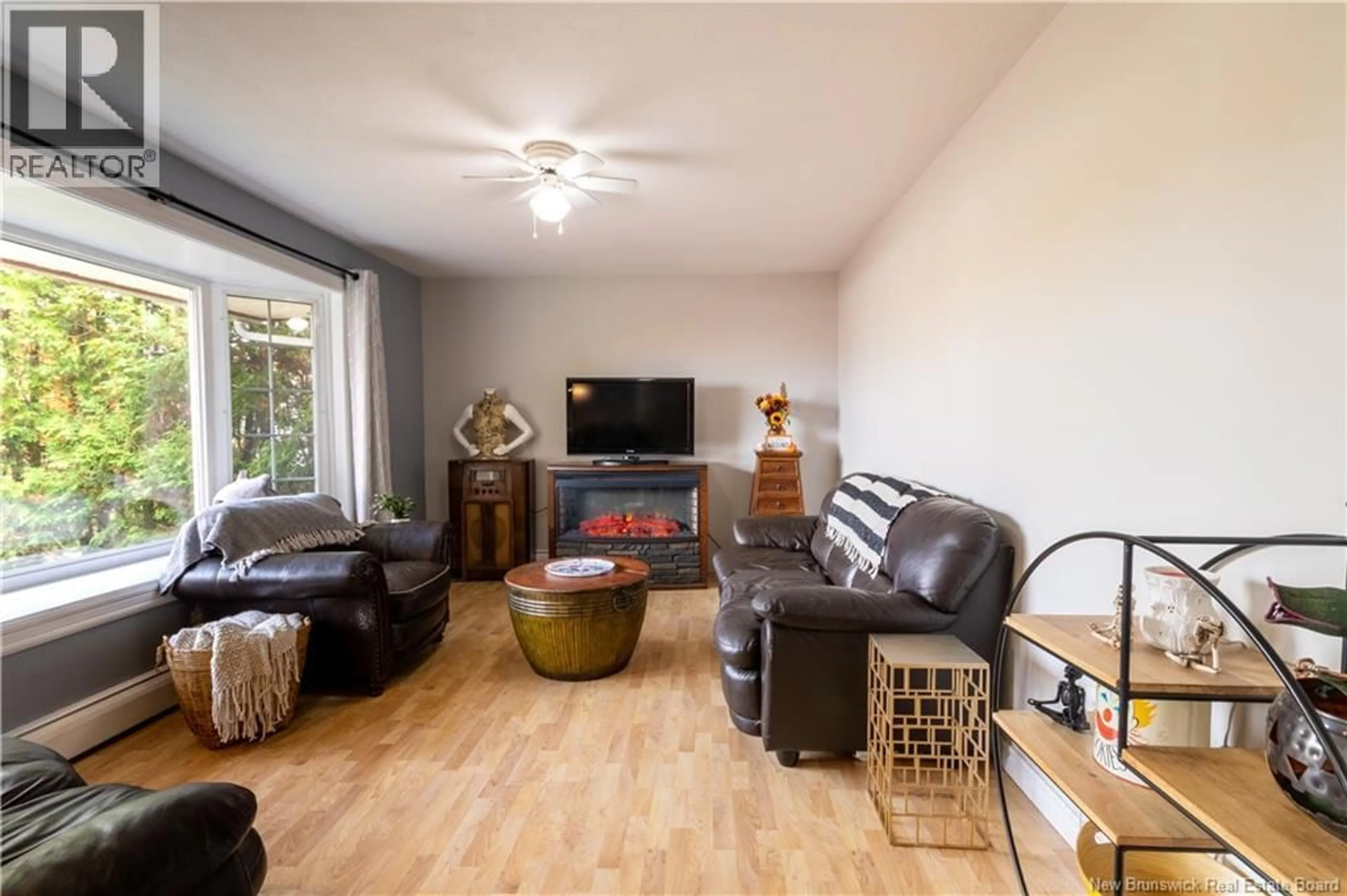 Living room with furniture, wood/laminate floor for 427 HOLDEN STREET, Oromocto New Brunswick E2V1G2