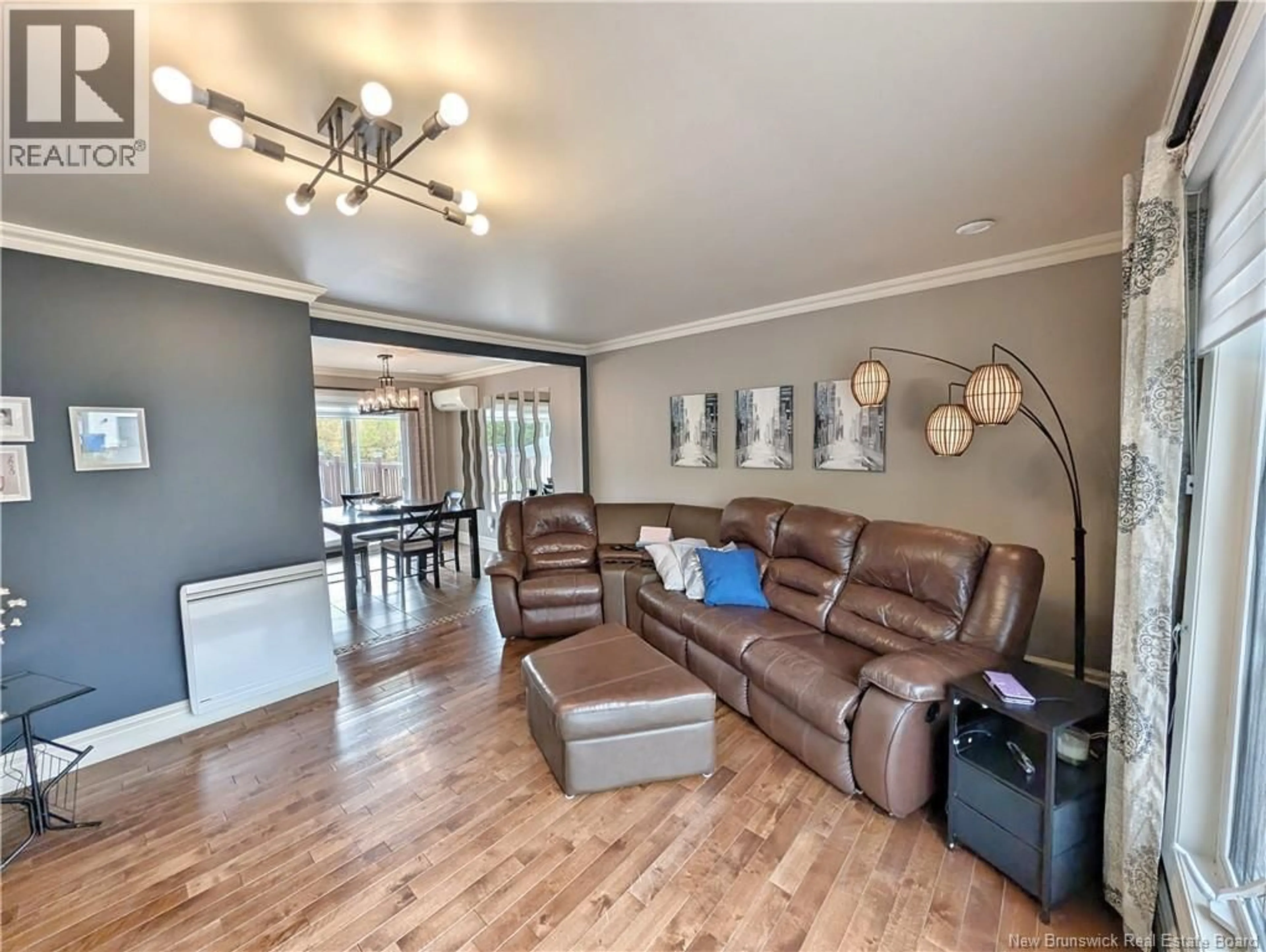 Living room with furniture, wood/laminate floor for 797 SAINT-JOSEPH BOULEVARD, Saint-Léolin New Brunswick E8N2N9
