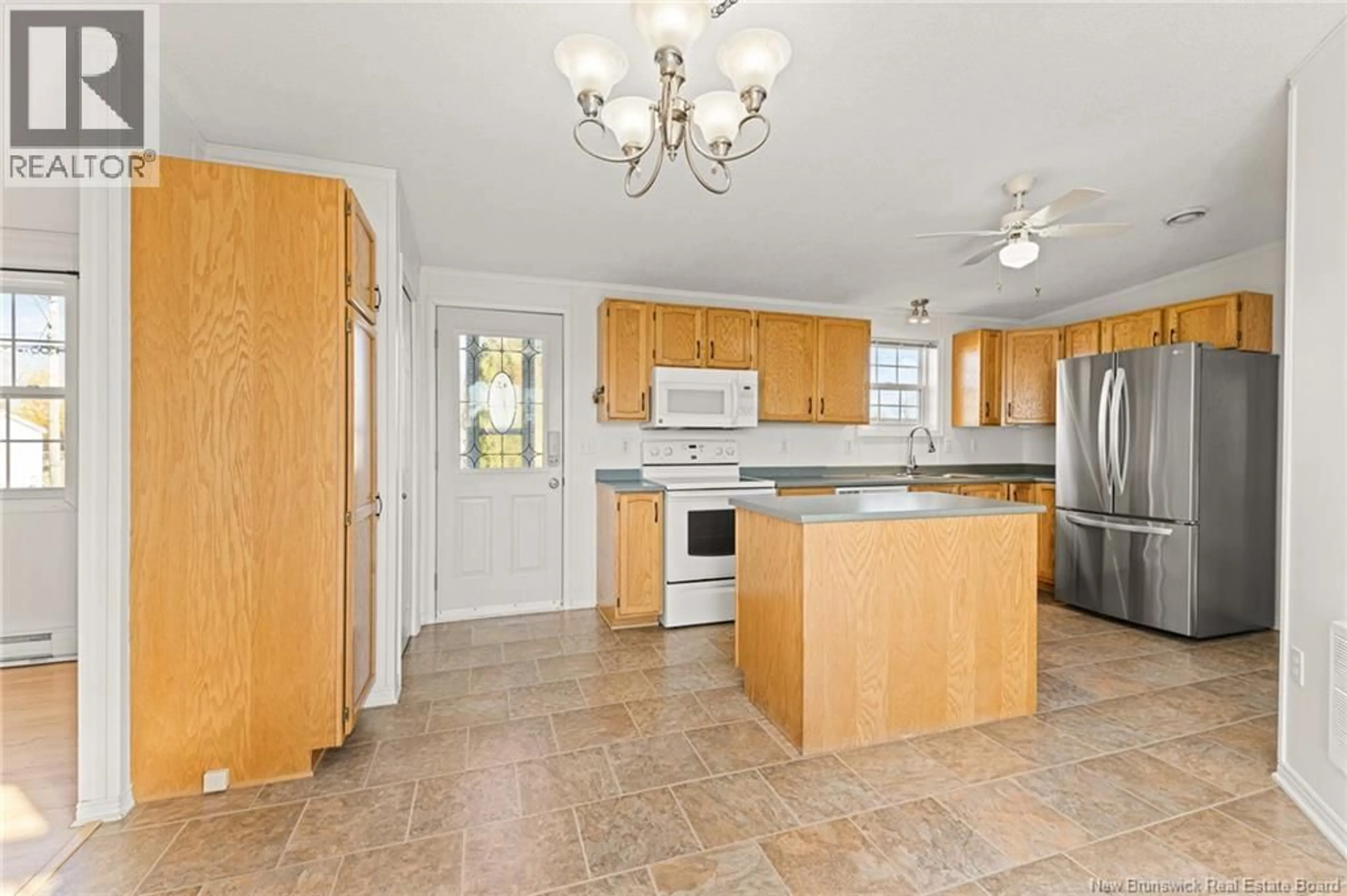 Open concept kitchen, ceramic/tile floor for 23 RICHIBUCTOU LANE, Dieppe New Brunswick E1A7N1