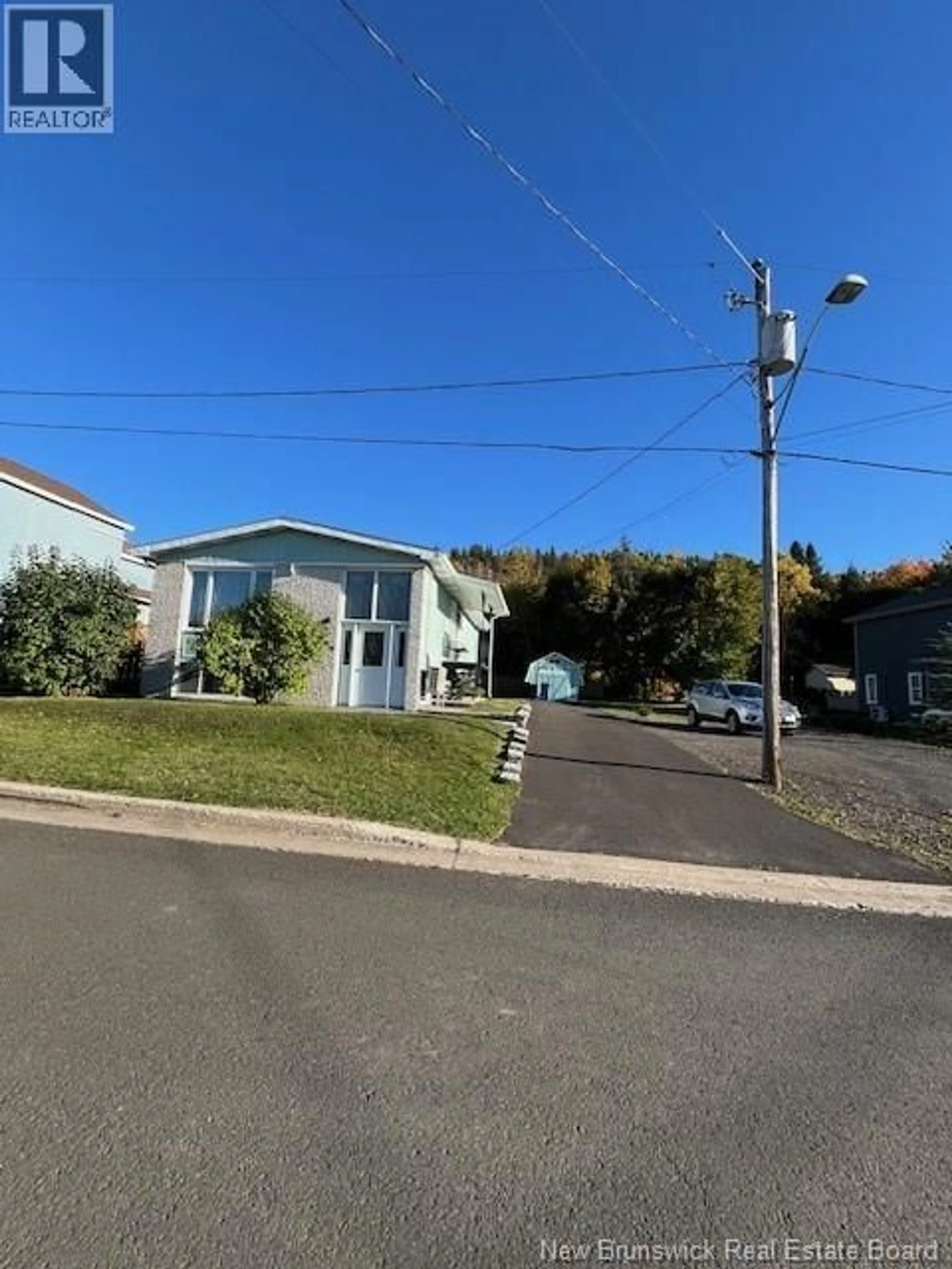 A pic from outside/outdoor area/front of a property/back of a property/a pic from drone, street for 196 FERGUSON STREET, Atholville New Brunswick E3N4P4