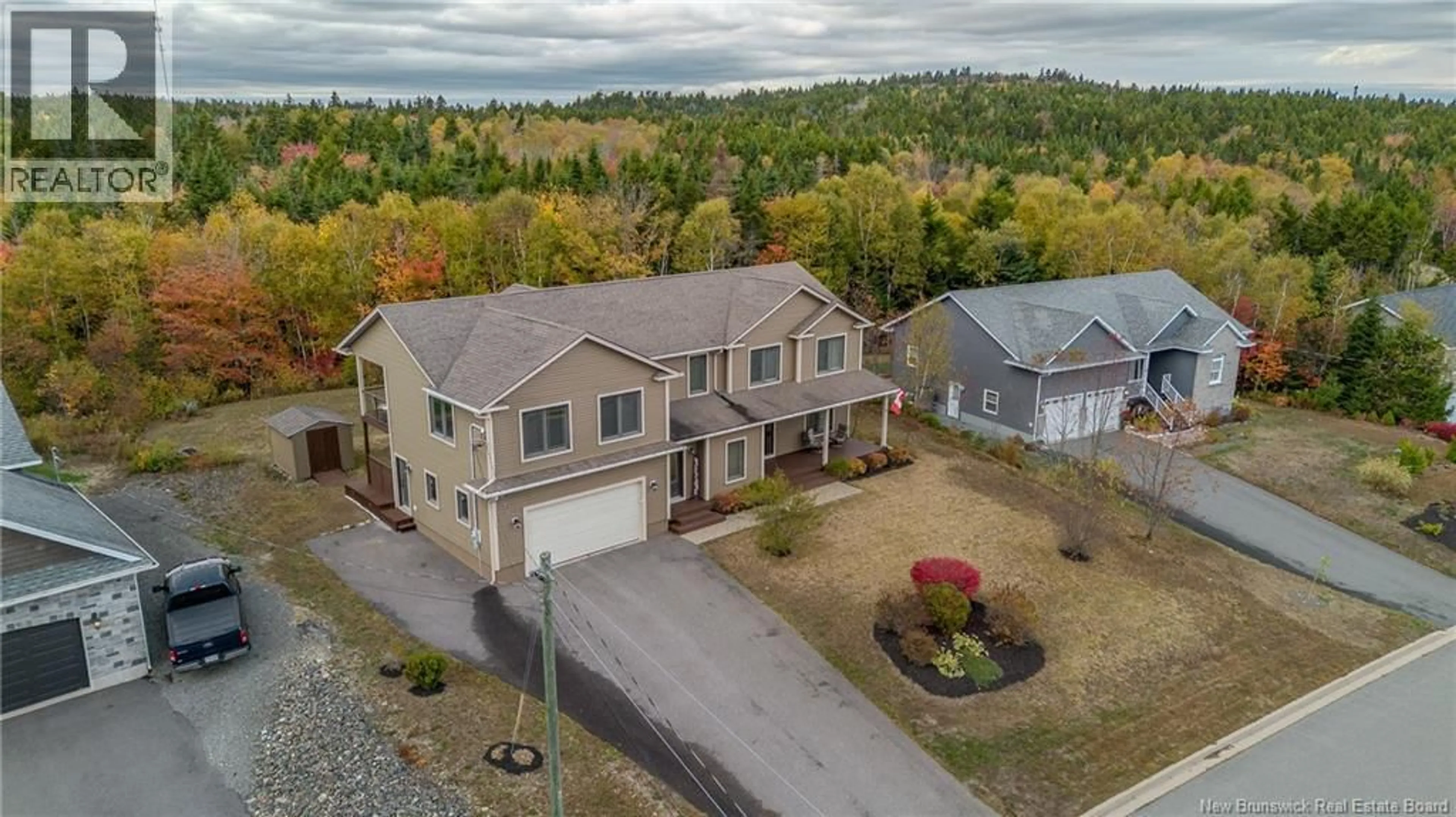 A pic from outside/outdoor area/front of a property/back of a property/a pic from drone, unknown for 18 MAPLECREST DRIVE, Grand Bay-Westfield New Brunswick E5K0B9