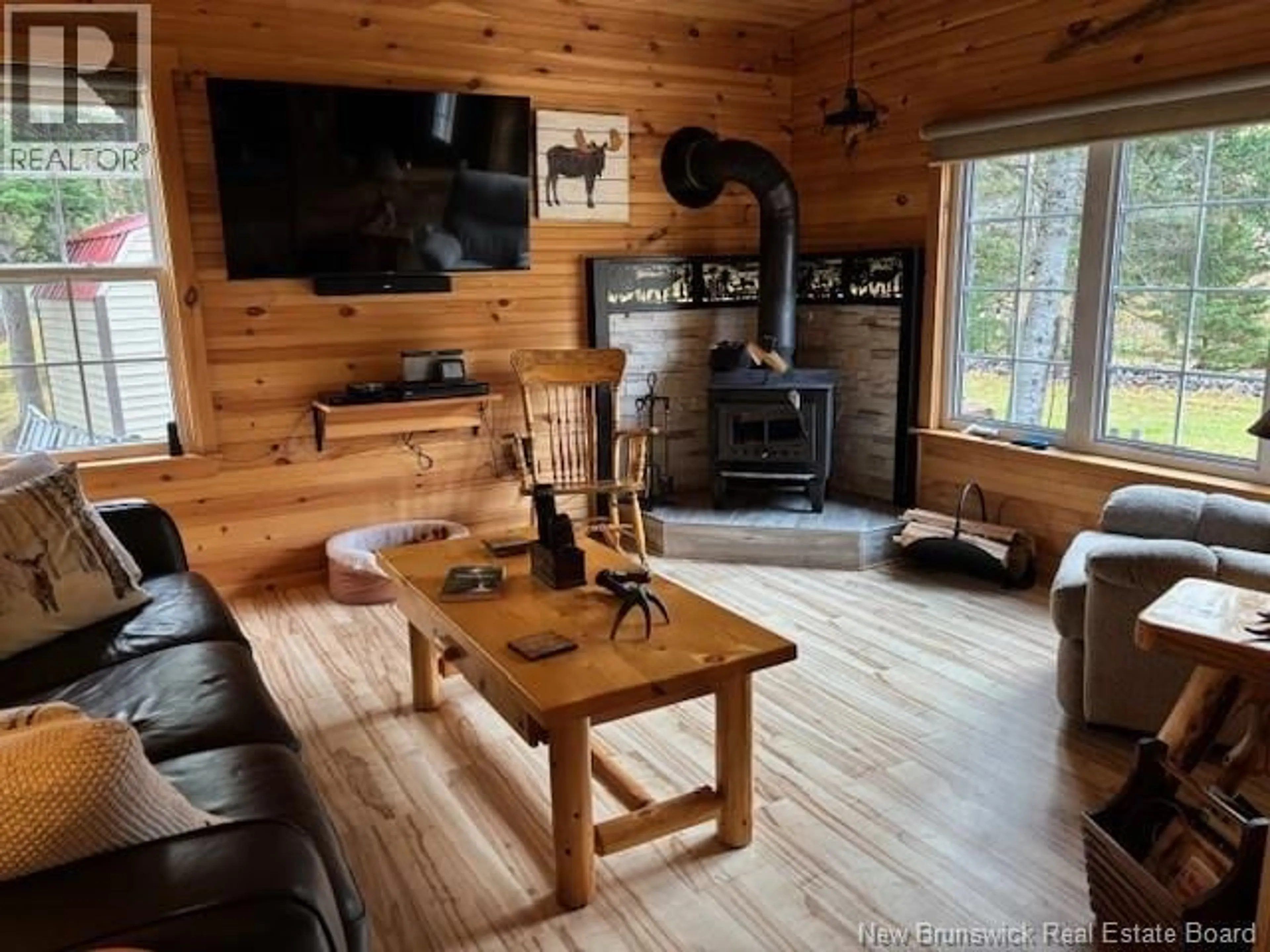 Living room with furniture, wood/laminate floor for 11581 ROUTE 114, Springdale New Brunswick E4E3Y4