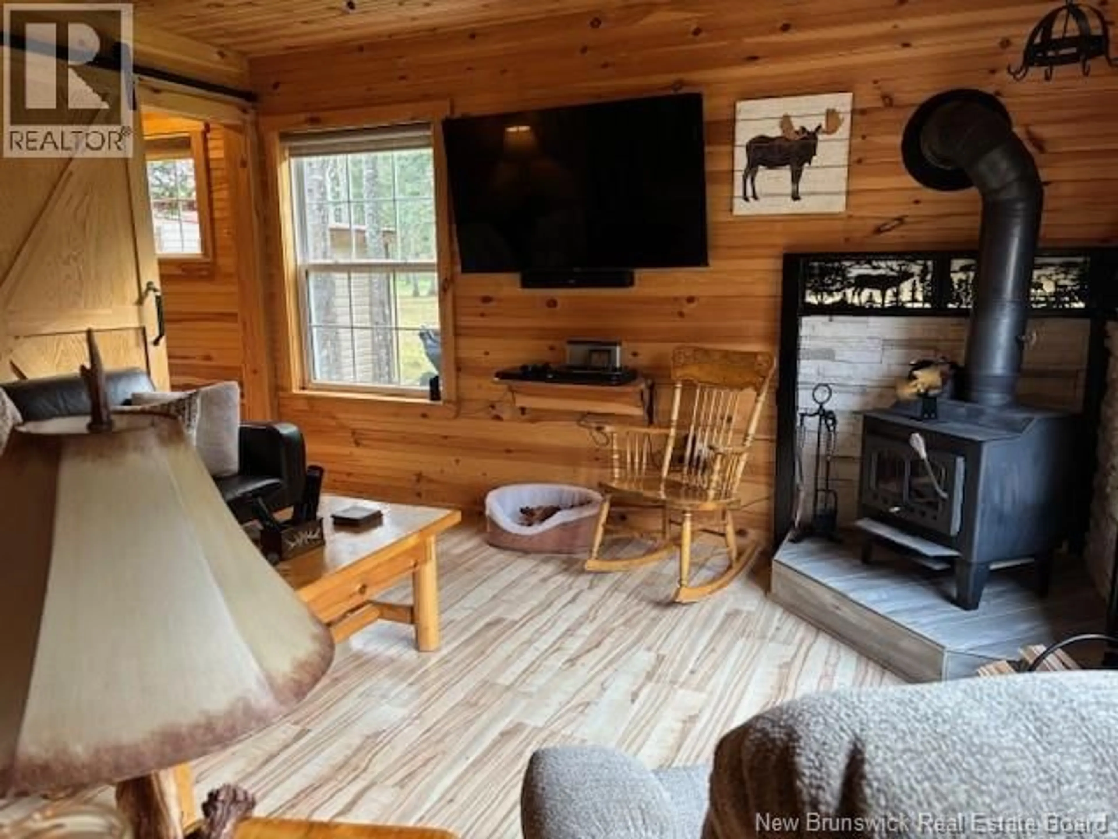 Living room with furniture, wood/laminate floor for 11581 ROUTE 114, Springdale New Brunswick E4E3Y4