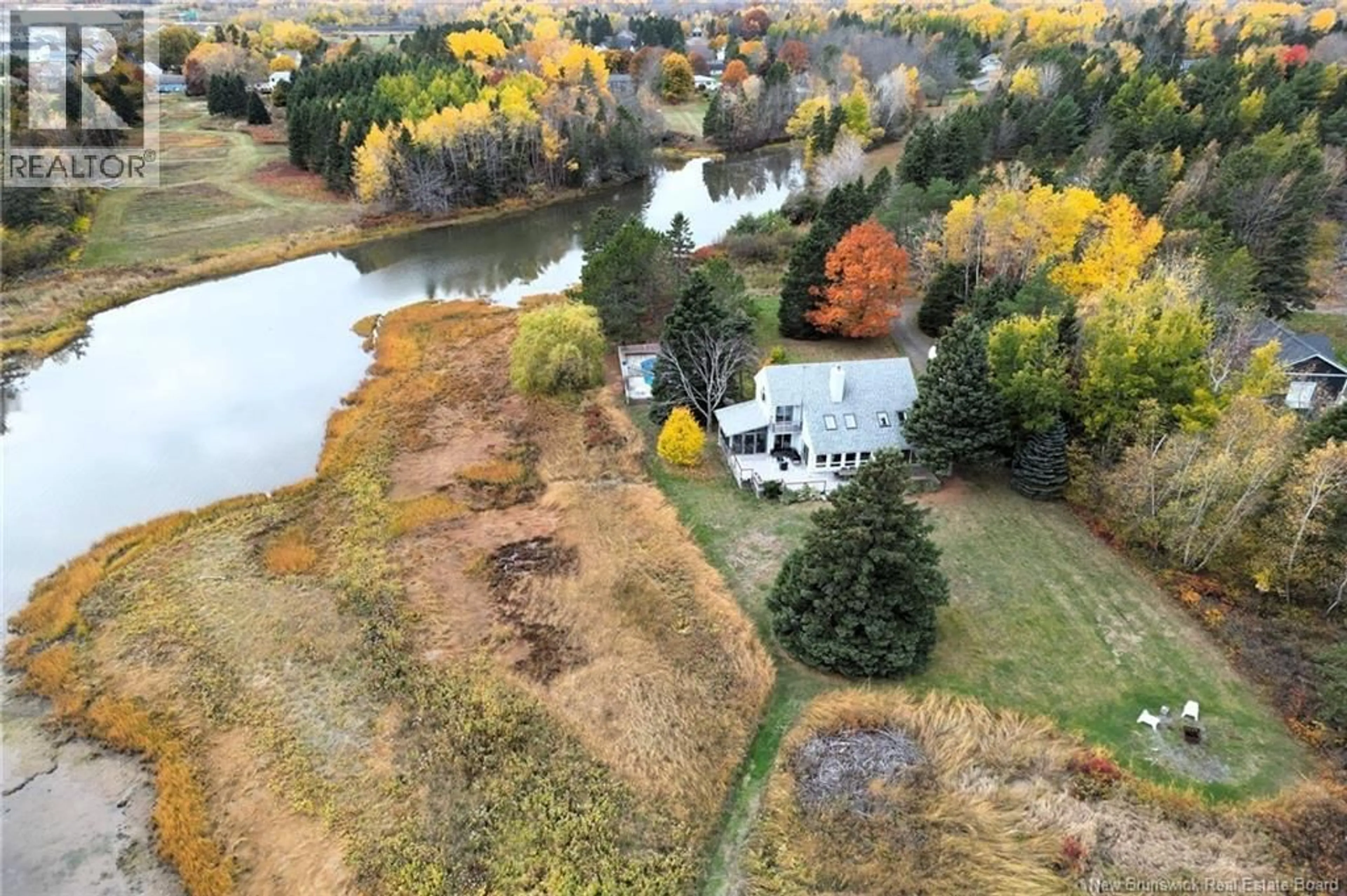 A pic from outside/outdoor area/front of a property/back of a property/a pic from drone, water/lake/river/ocean view for 48 HERON WAY, Shediac Cape New Brunswick E4P3C1
