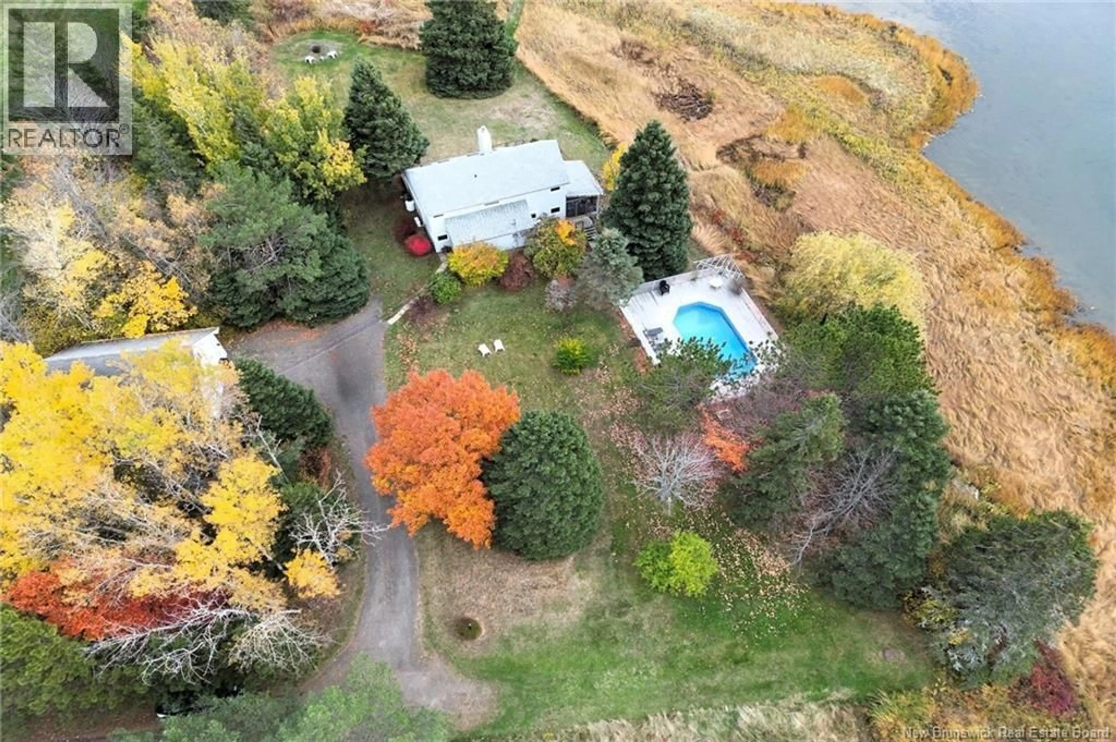 A pic from outside/outdoor area/front of a property/back of a property/a pic from drone, water/lake/river/ocean view for 48 HERON WAY, Shediac Cape New Brunswick E4P3C1